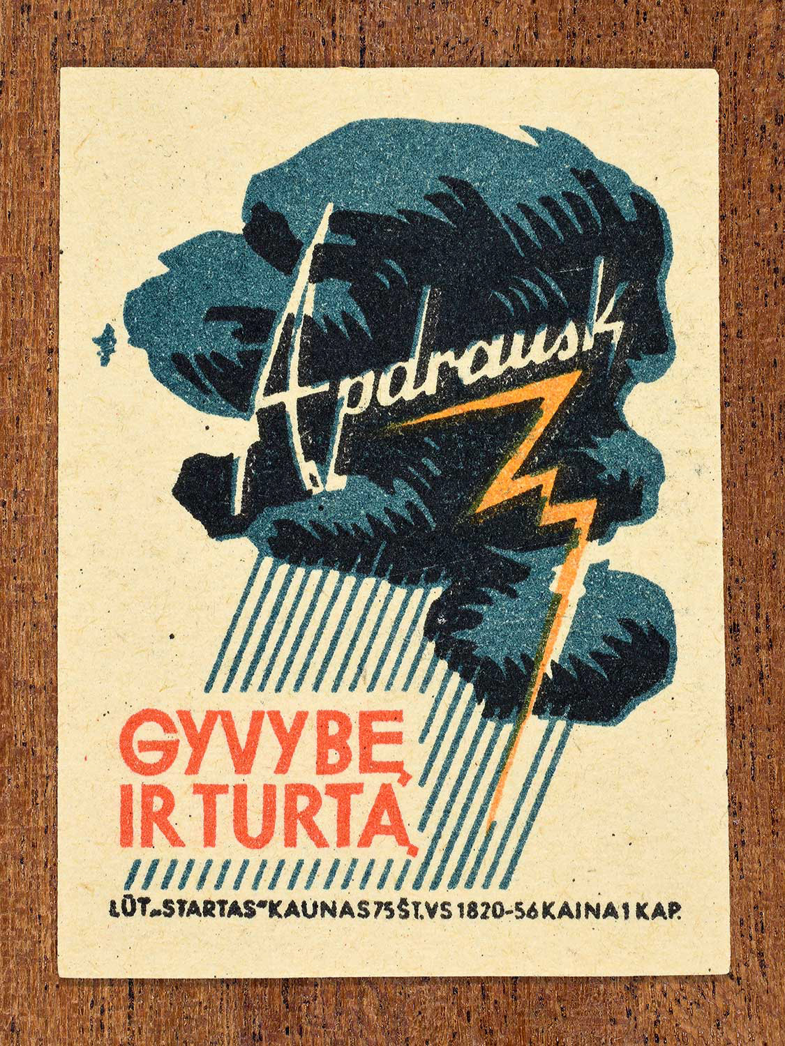 Vintage 1963 Lithuanian matchbox label showing dark storm clouds with lightning in blue, orange, and black colours. Produced by the Startas Kaunas match factory to promote insurance for life and property.