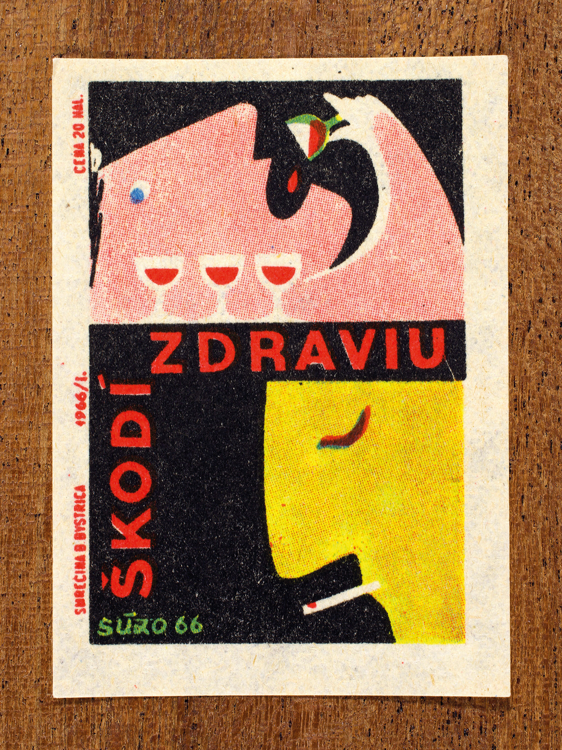 Vintage 1966 Czech matchbox label by Solo Smrečina B. Bystrica featuring two figures – one drinking alcohol and one smoking, and warns that both activities are harmful to health.