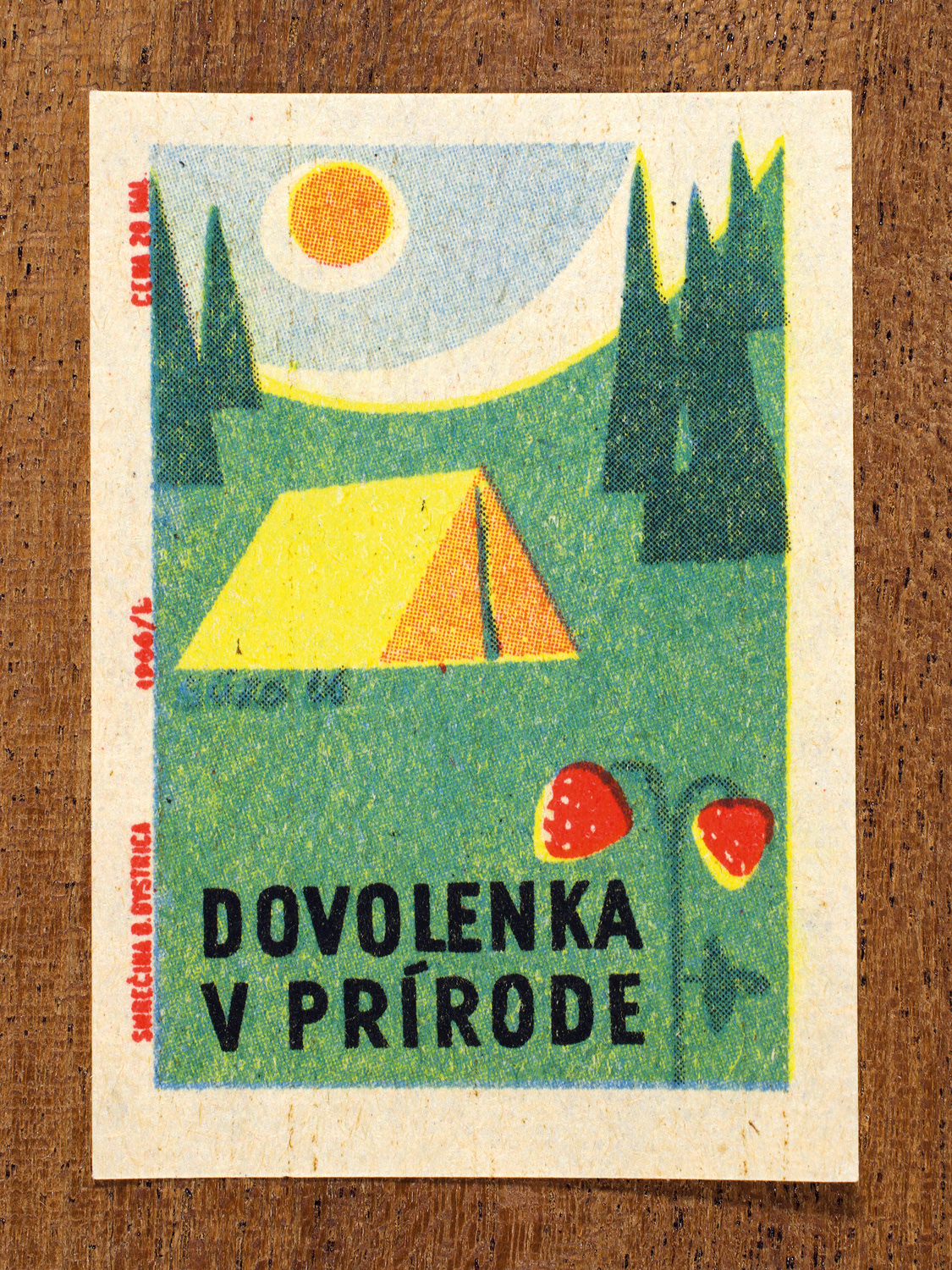 Vintage 1966 Czech matchbox label by Solo Smrečina B. Bystrica featuring a stylised tent and pine trees under a sun, on green background. It promotes outdoor activities to boost wellbeing.