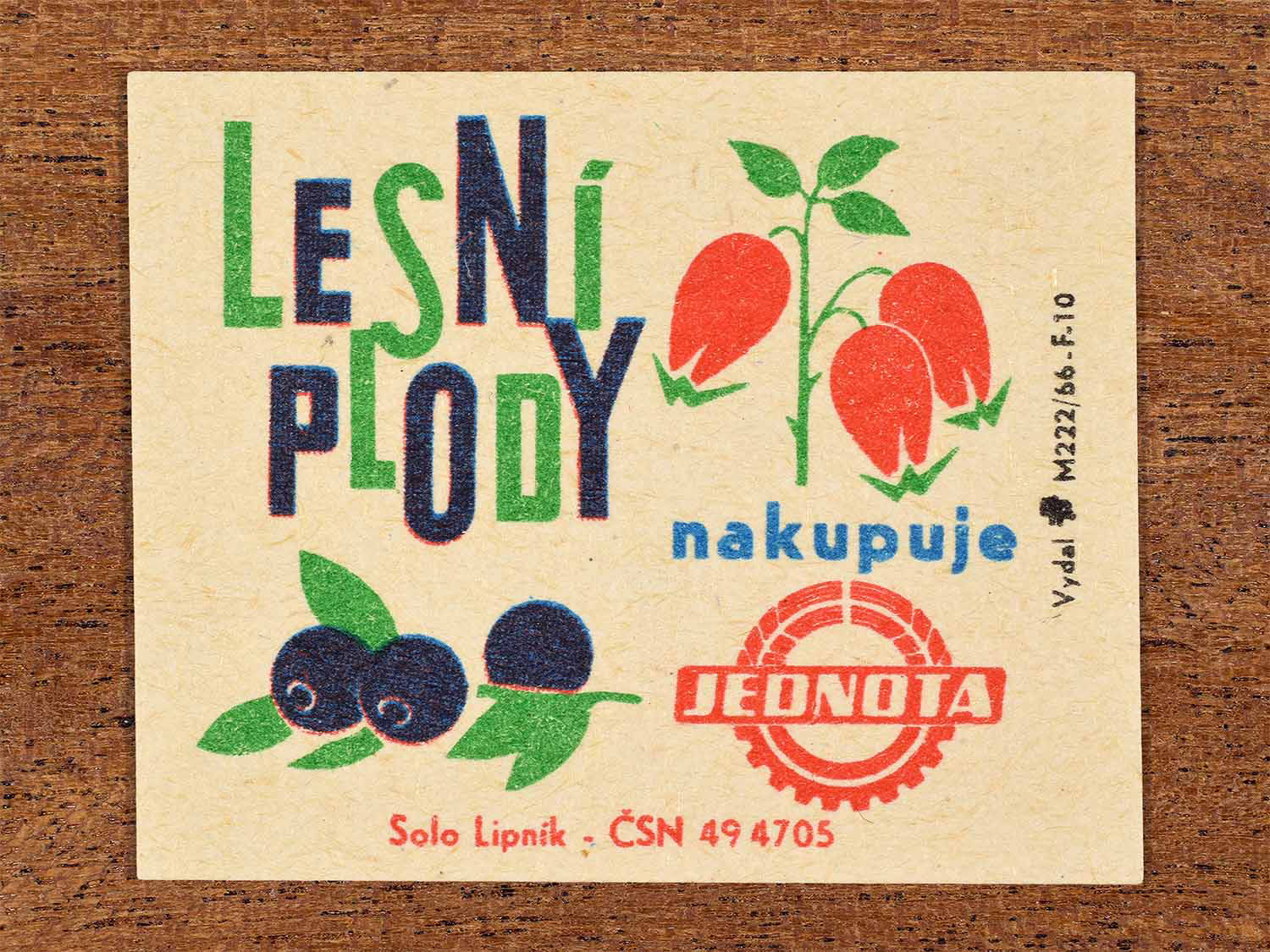 Vintage c. 1966 Czech matchbox label showing stylised wild berries and flowers in red, blue and green colours. Produced by the Solo Lipník match factory to promote Jednota purchasing forest fruits.
