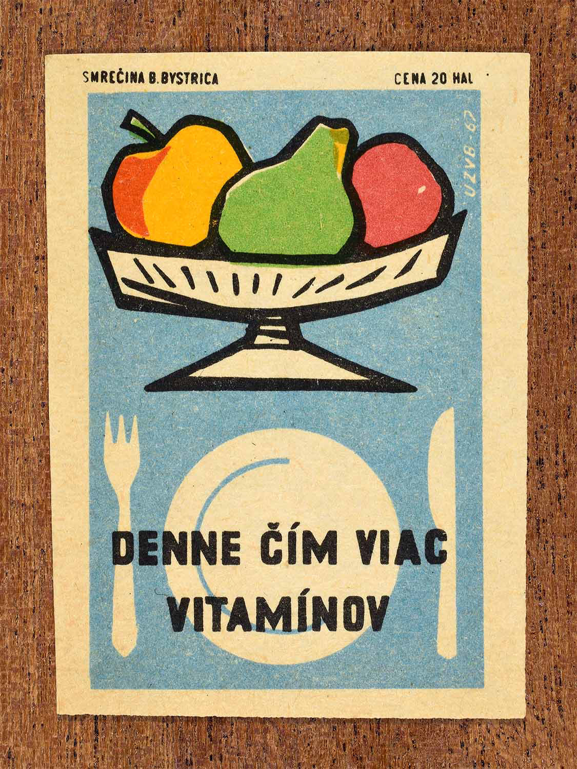 Vintage 1967 Czech matchbox label showing a plate and cutlery with a bowl of fruit above, in bright colours. Produced by the Smrečná match factory, Banská Bystrica, to encourage daily vitamin intake through fruit consumption.
