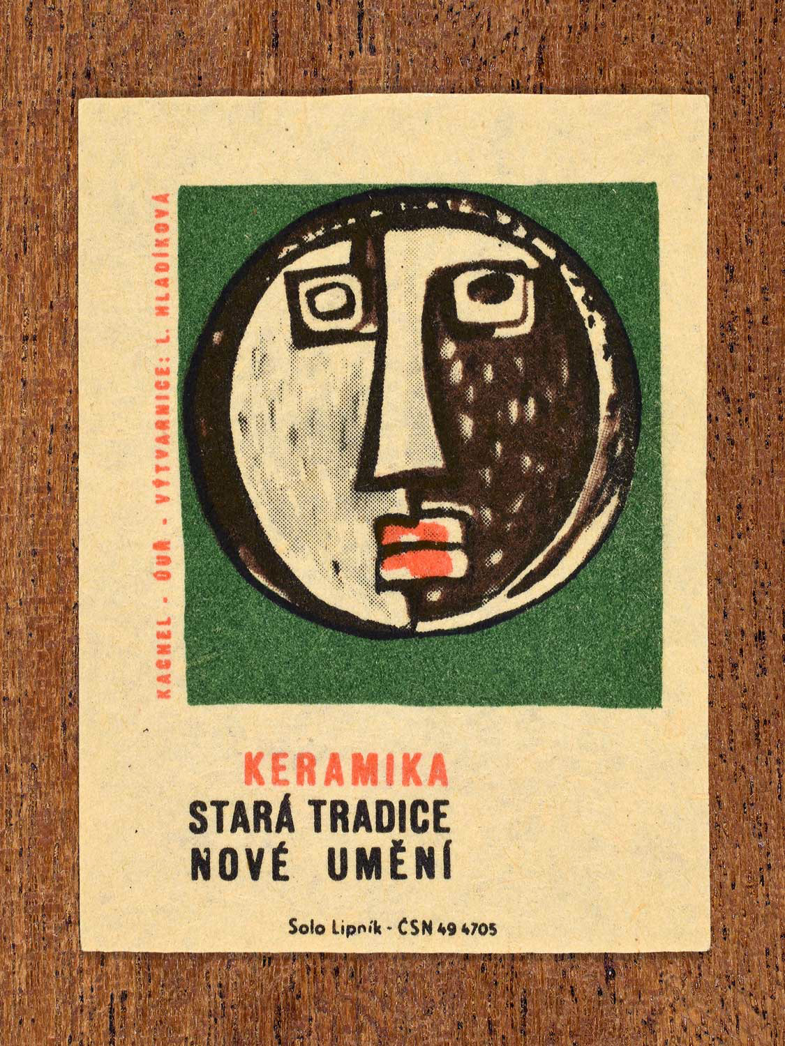 Vintage 1964 Czech matchbox label showing a ceramic tile face by L. Hladíková. Produced by the Solo Lipník match factory to promote ceramics as an evolving art form.