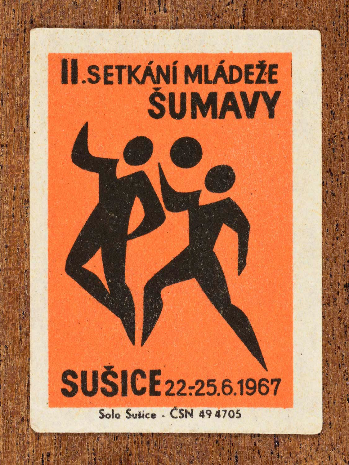 Vintage 1967 Czech matchbox label showing two youths competing for a ball. Produced by the Solo Sušice match factory to promote teamwork and physical activity in youth programmes.