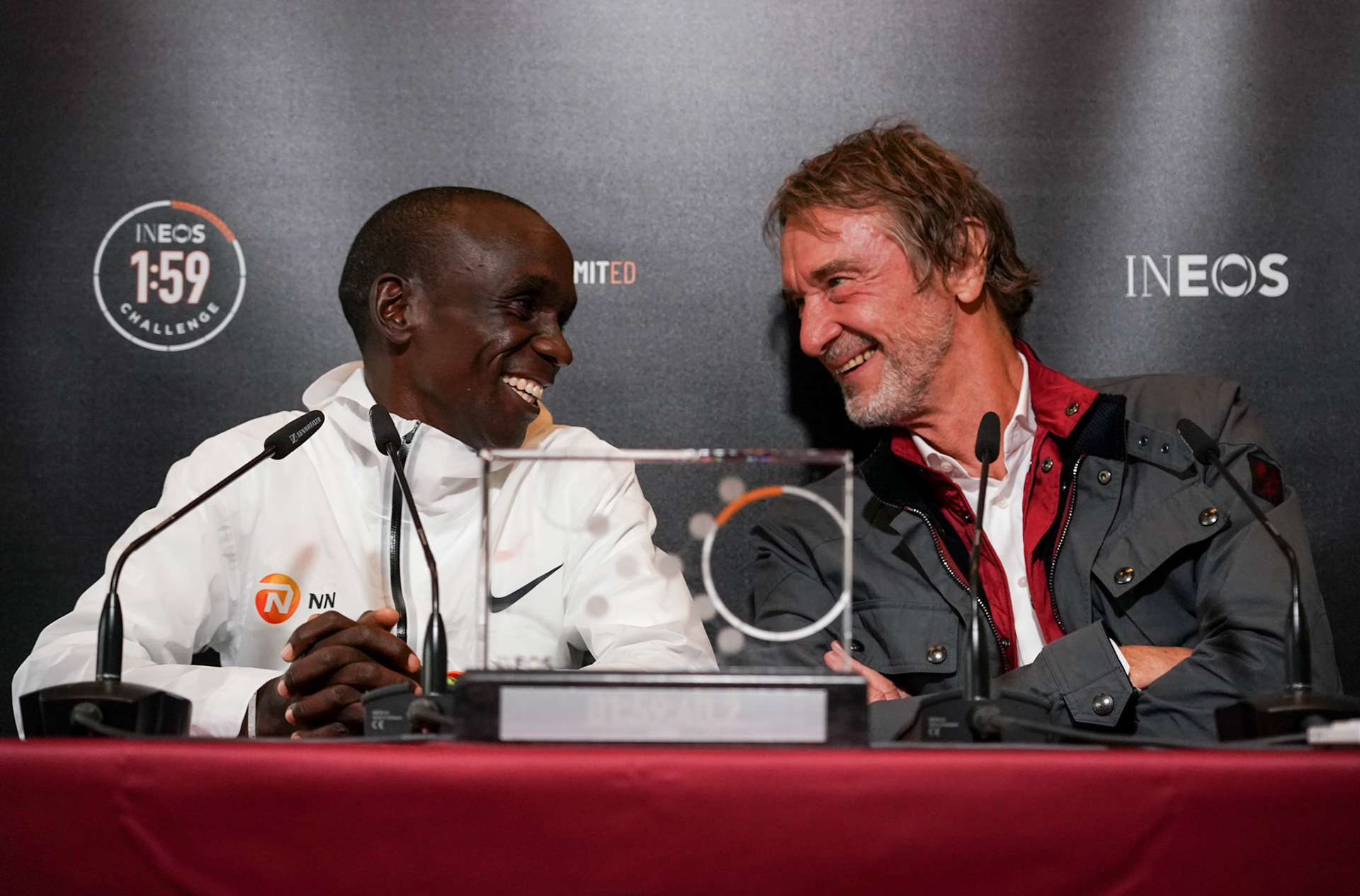 Free for editorial use and archive. Eliud Kipchoge talks to the media alongside Sir Jim Ratcliffe, chief executive of INEOS, in a press conference after making history by running a marathon in an official time of 01:59:40. The INEOS 1:59 Challenge, Vienna, Austria. 12 October 2019.
Photo: Jed Leicester for The INEOS 1:59 Challenge