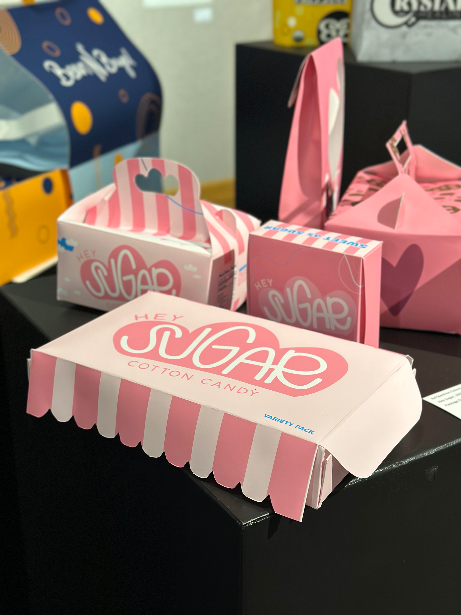 Hey Sugar is a cotton candy brand with fun and playful colors to represent the circus.