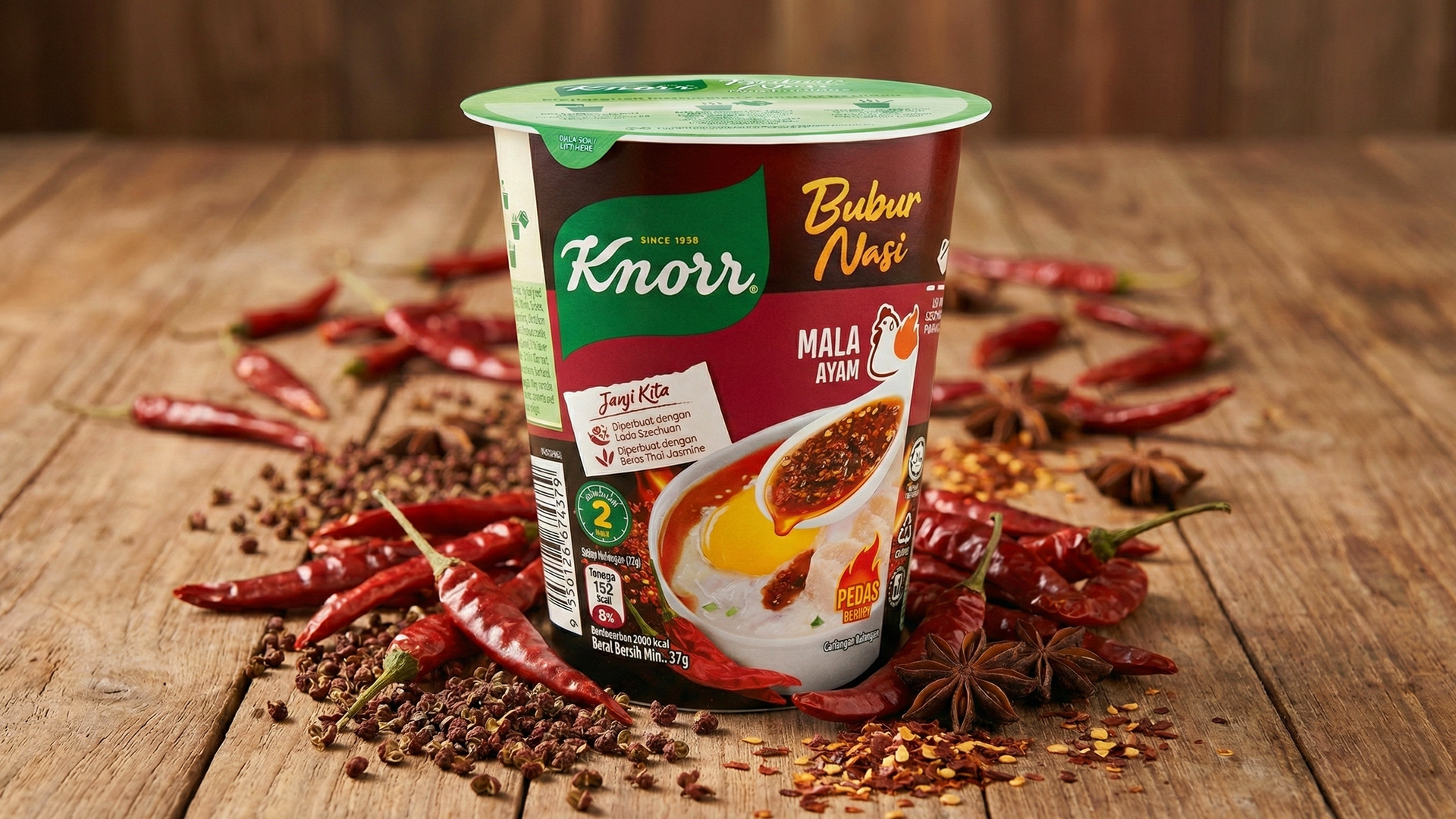 Knorr Bubur Nasi Mala Ayam cup porridge packaging design in environmental food photography — halal-certified FMCG food packaging by Laugh Contagious Communications, creative agency in Kuala Lumpur