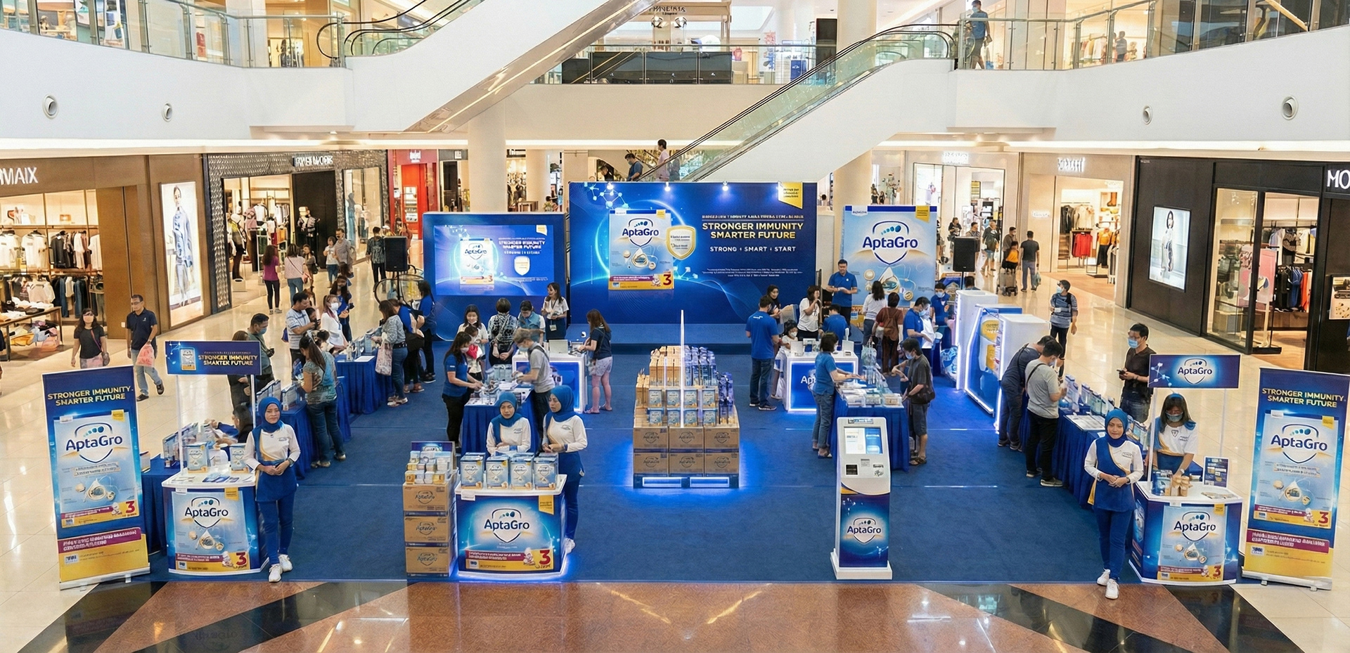 AptaGro mall atrium roadshow activation with brand promoters and sampling stations — pediatric nutrition shopper marketing by Laugh Contagious Malaysia