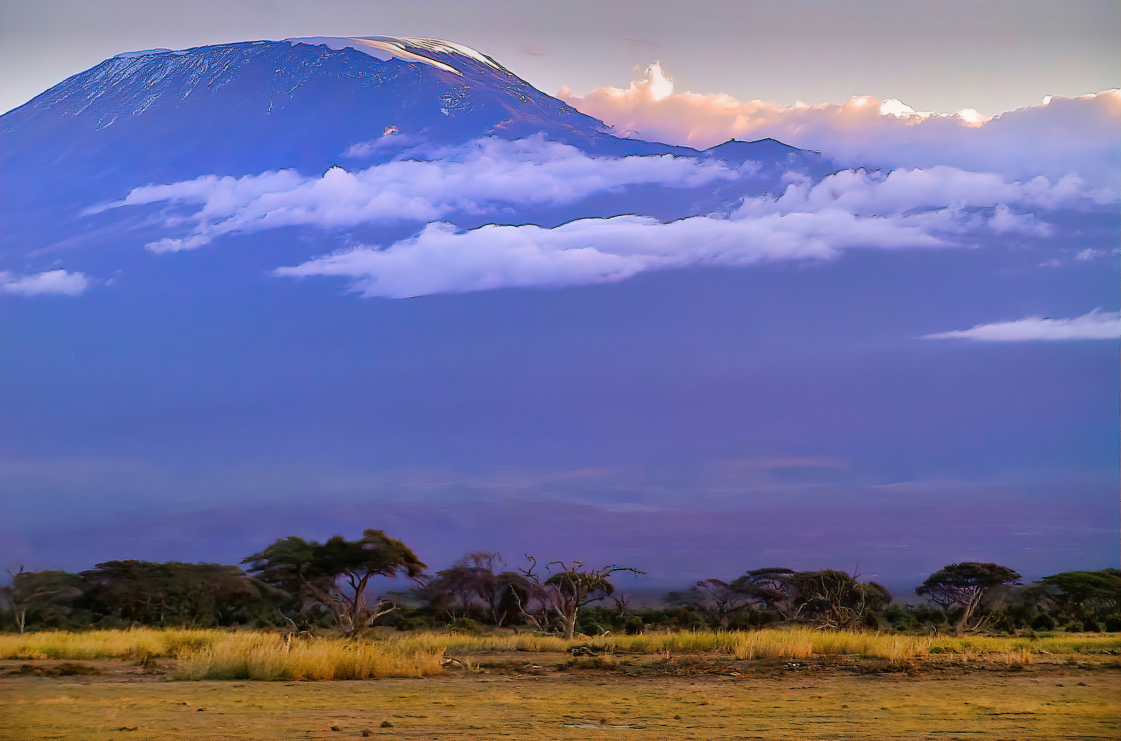 Clouds drift near the peak of Mount Kilimanjaro, Kenya, whose Kibo peak is the highest mountain in Africa.