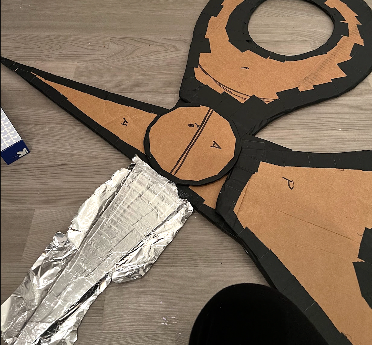 Cardboard and tin foil make up the "Beauty School Dropout" props