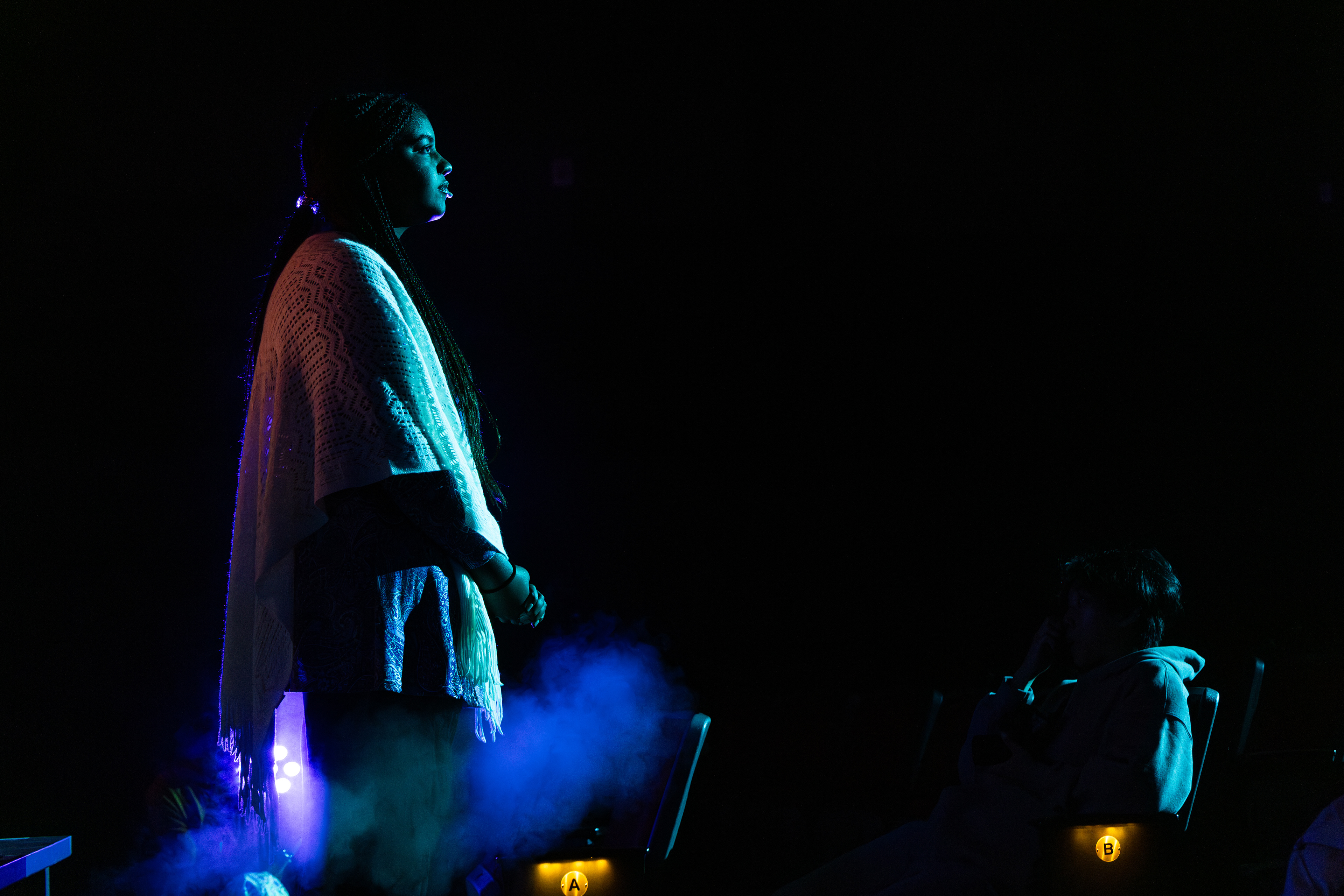 Handheld LEDs illuminate Olive's parents in the house during "The I Love You Song"