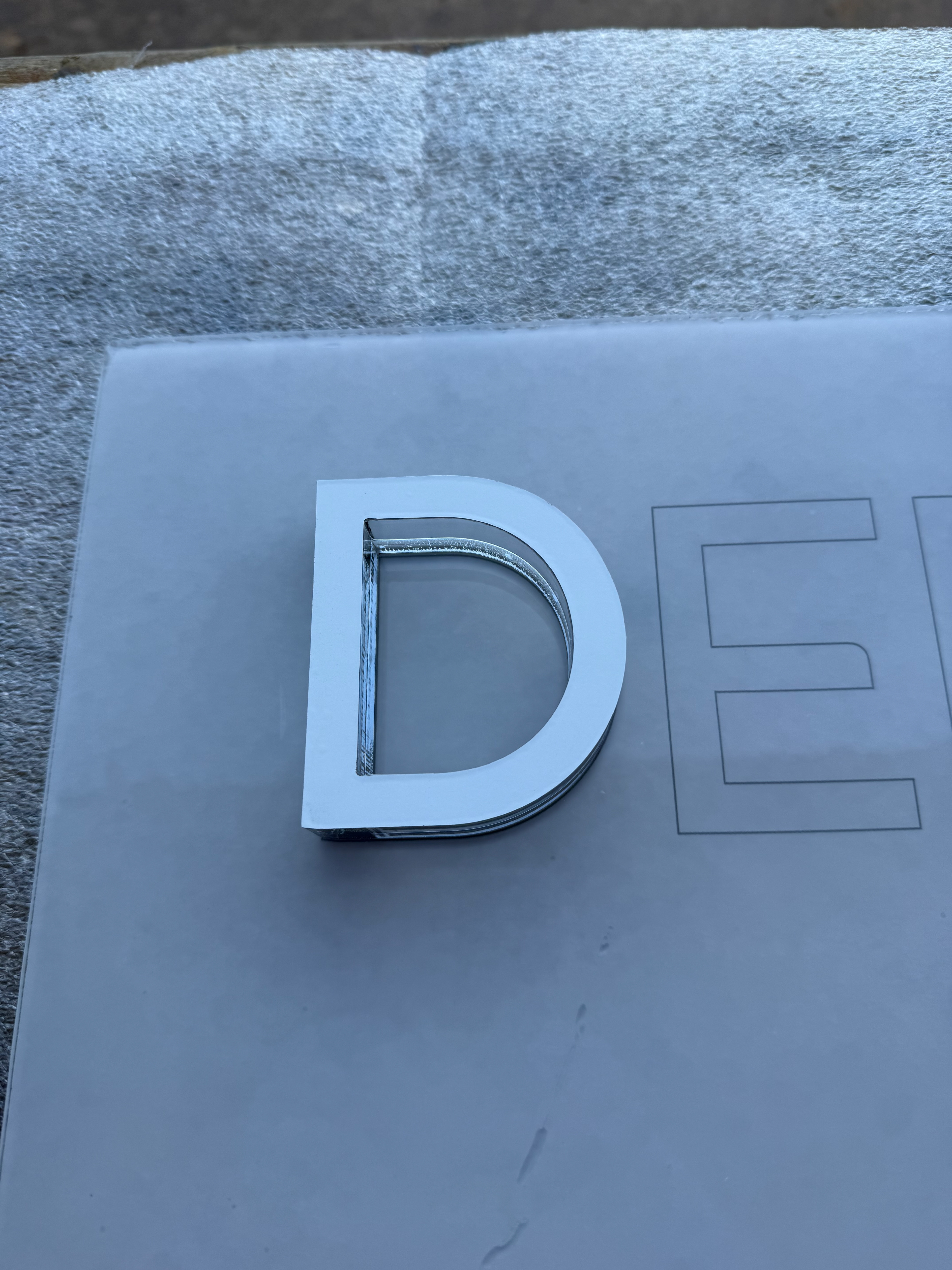 1/4" Clear Acrylic with White Vinyl on top of Outlined Text