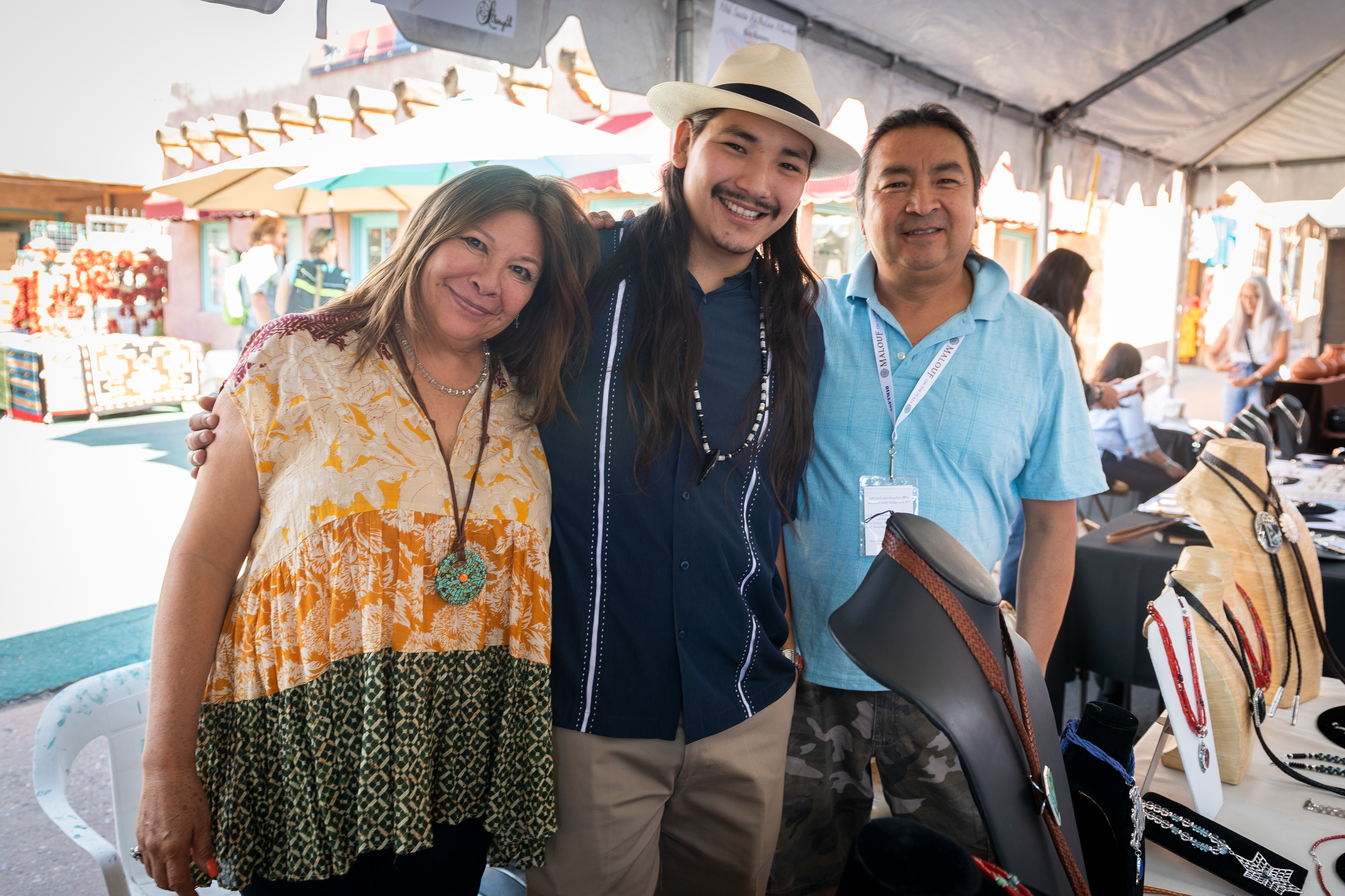 Marian, Cree and Steve at their Indian Market booth.
