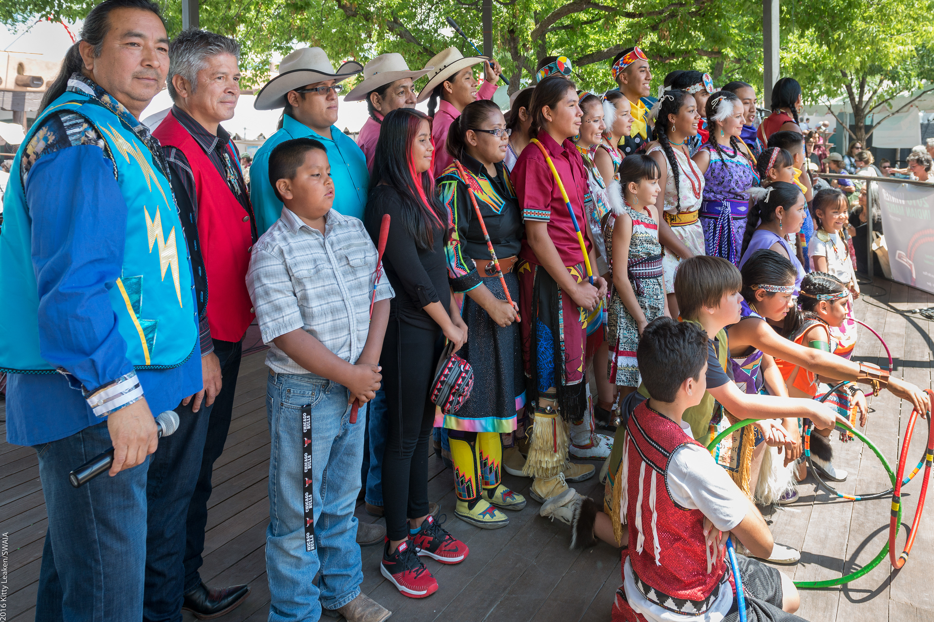 Steve, far left, emcees the Lightning Boy Hoop Foundation performance at Indian Market.