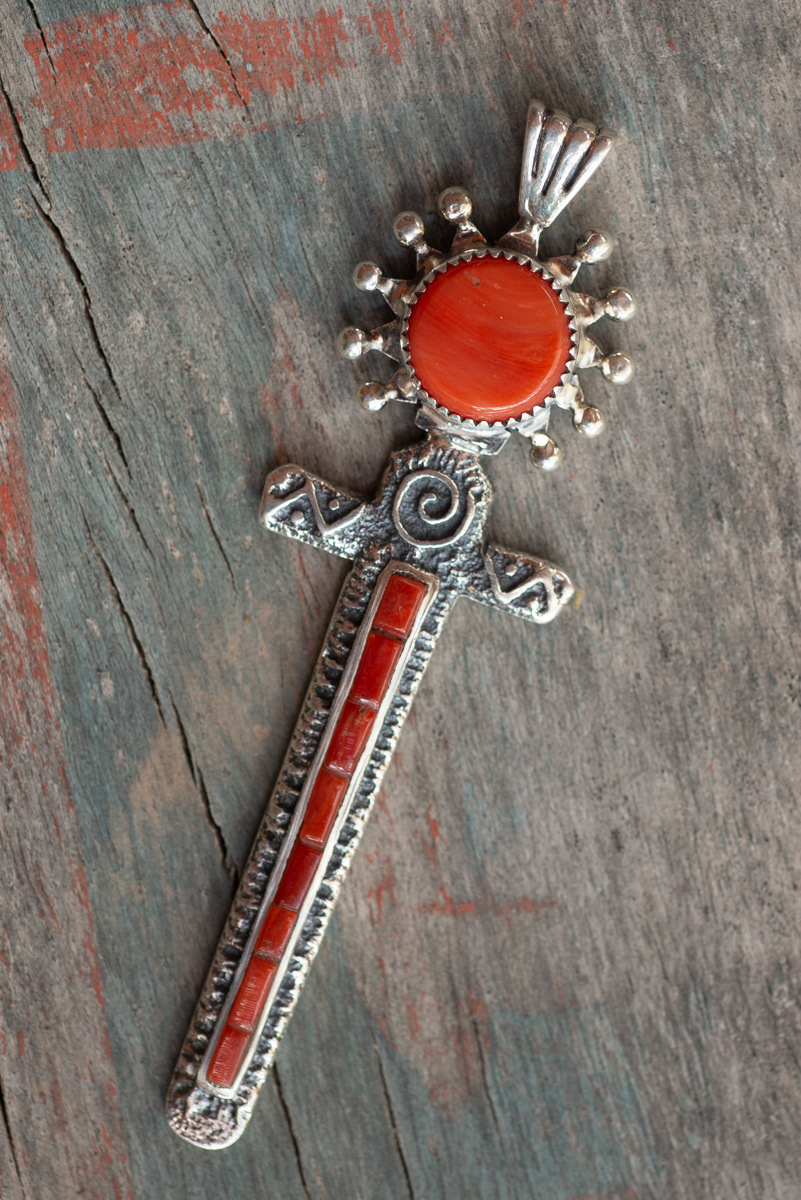 A coral and silver pendant, tufa-cast by Steve.