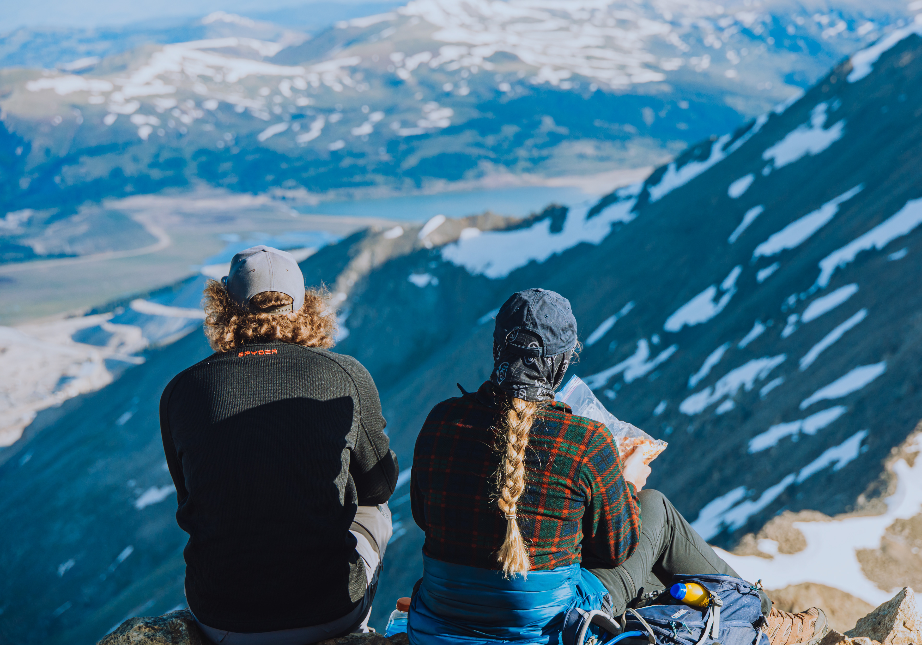 Fellow hikers atop Mt. Democrat, overlooking a molybdenum mine, bag-pizza in hand.