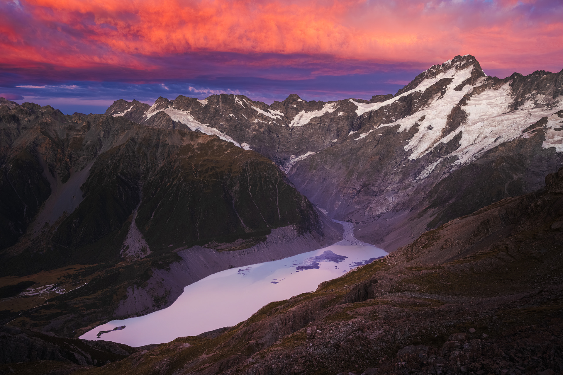 Mount Sefton, Sharks Teeth, and Eagle Peak rise behind Mueller Lake