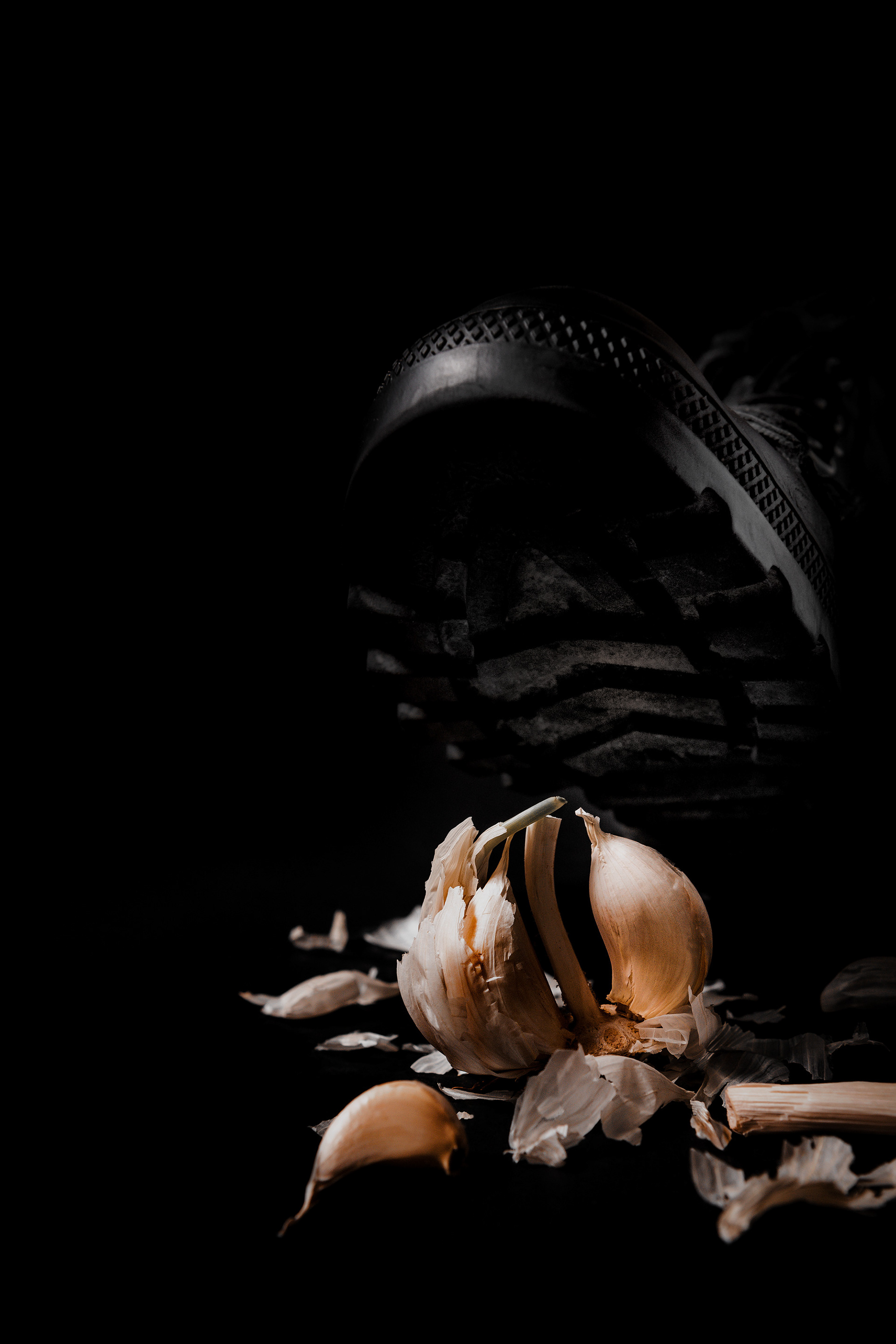 conceptual still life with crushed garlic referencing anatomy