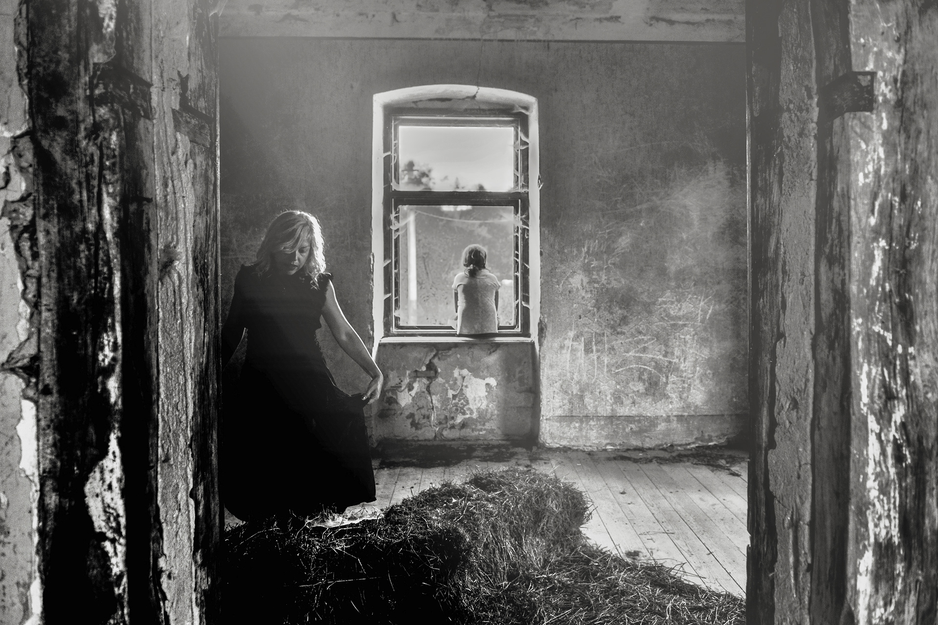 abandoned rural house window with interior silhouette