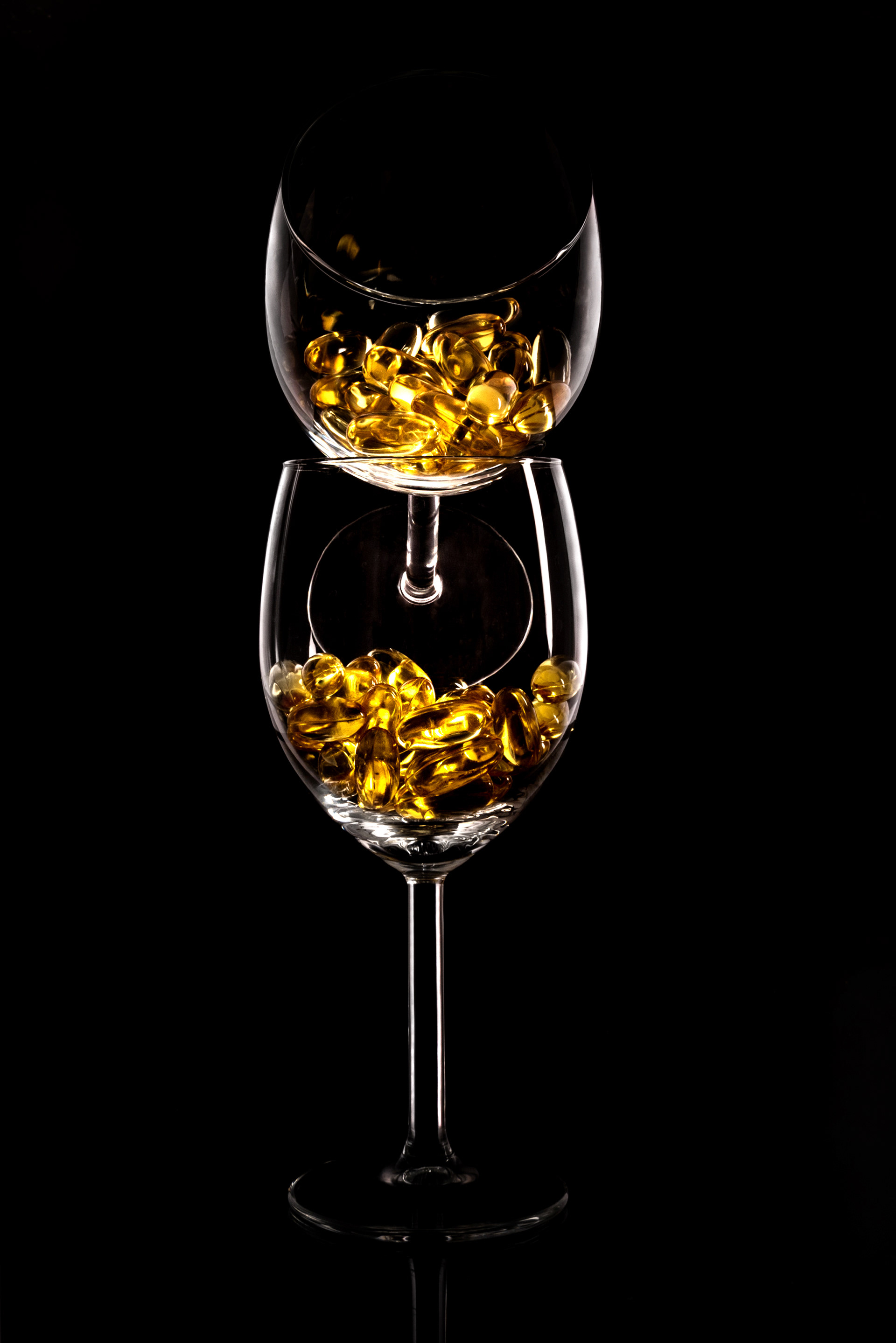 stacked glass vessels with golden fragments inside