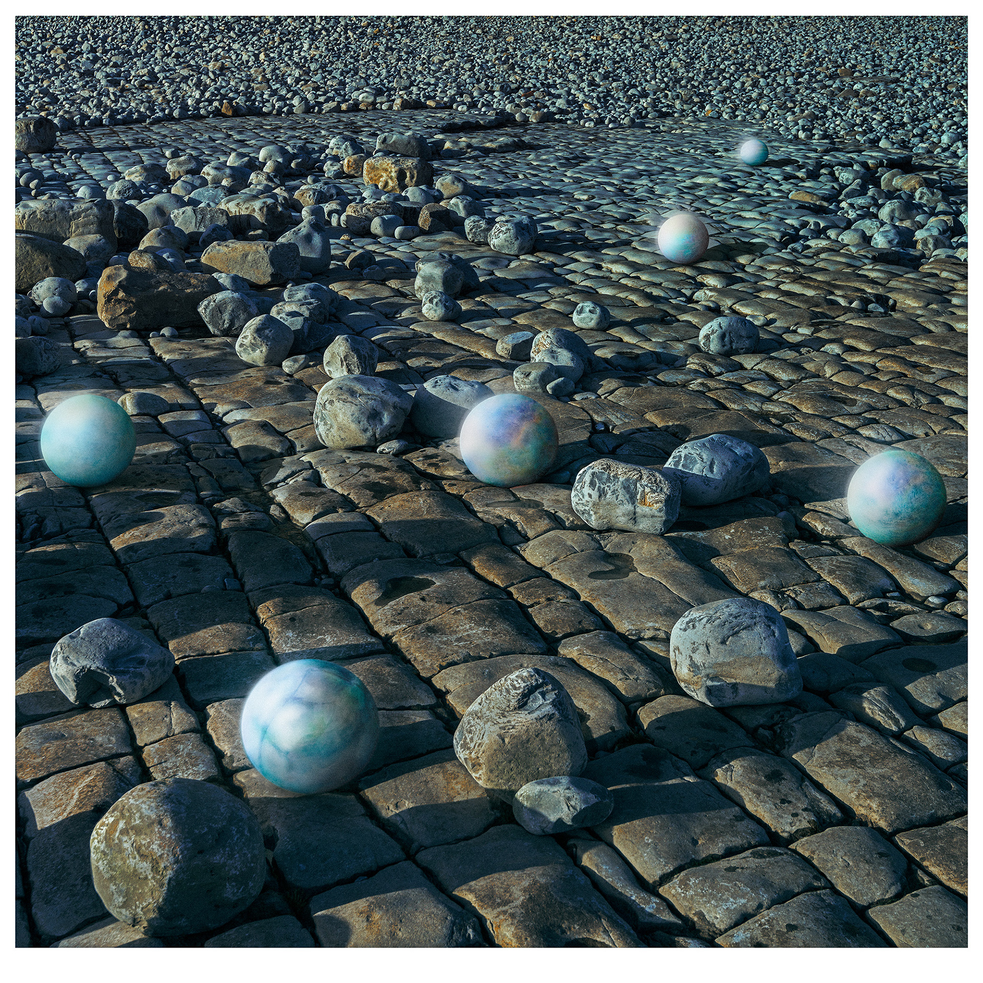 Universe D The background photograph of this composite image was a taken at a coastal site in Wales, UK, showing an grey base Jurassic rock formation with millions of scattered boulders reaching from the foreground to the horizon. sitting on the Jurassic base rock are six spherical images that represent planets. the planets from an arrow shape from top right to to bottom left.