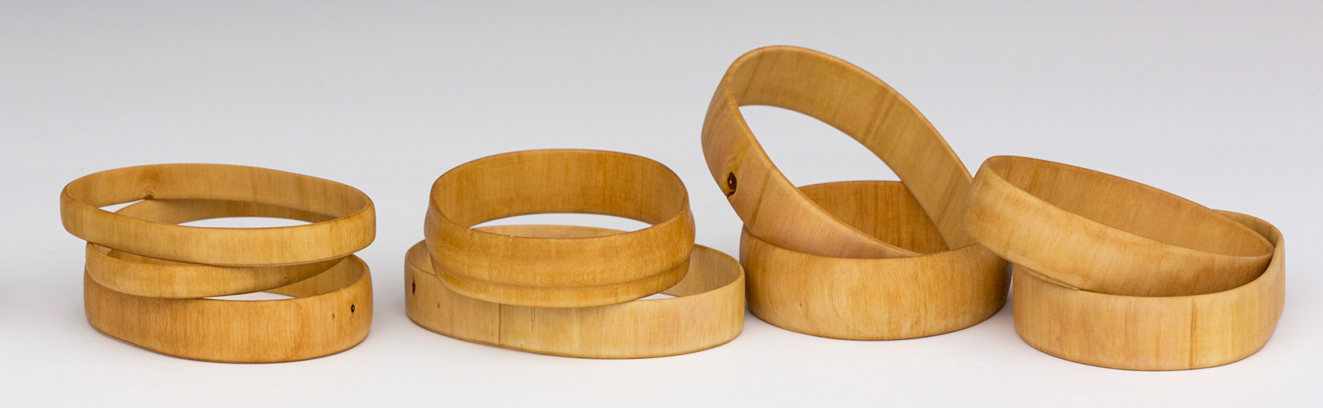 Plum Bracelets (9) - Diameter: 2 1/4 to 3 1/8 inches, Height: 5/16 to 3/4 inches (F123)