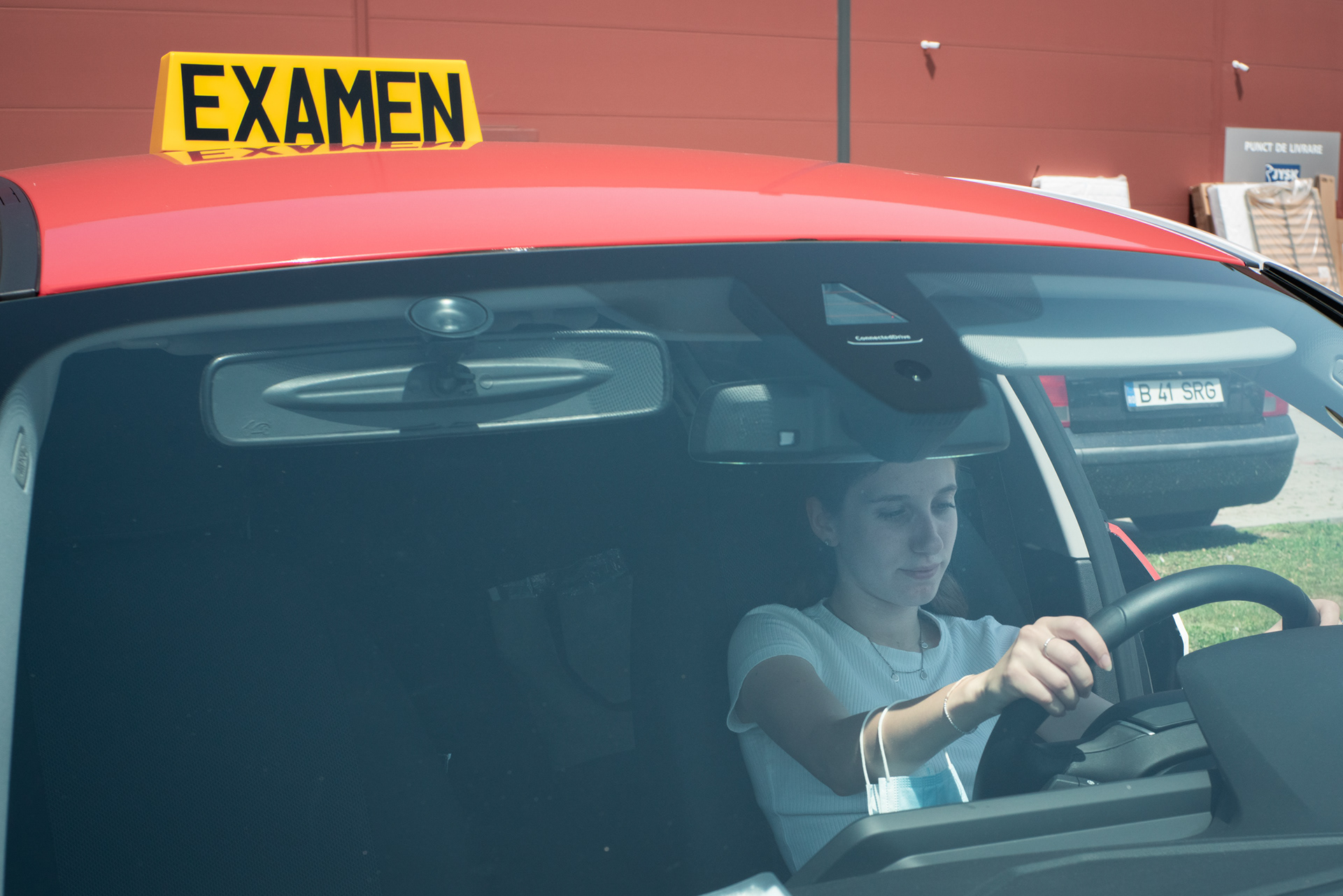 Diana waiting for her driving test to begin. Bucharest, June 2021.