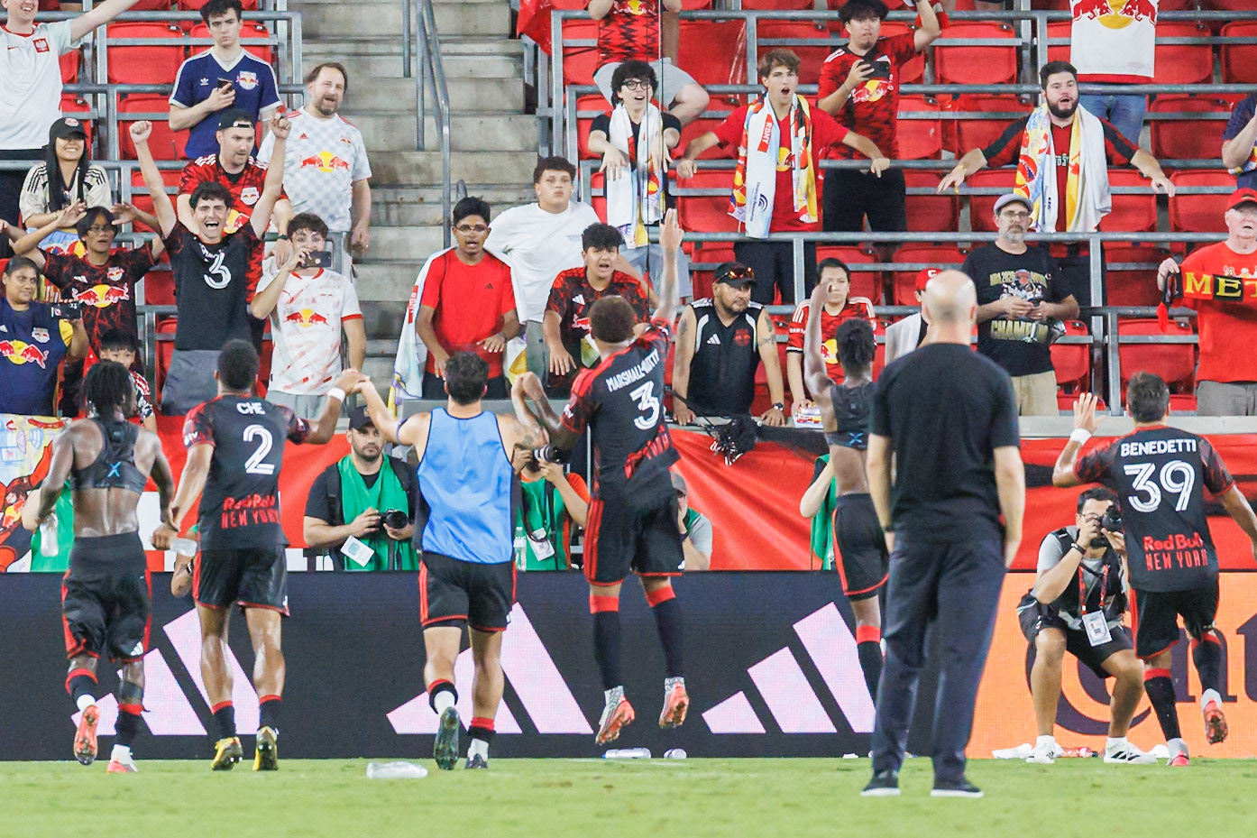 New York Red Bulls players celebrate the 3-2 win over Orlando City SC.