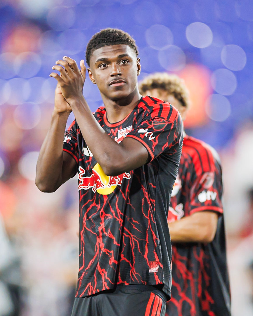 Omar Valencia applauds supporters after the match.