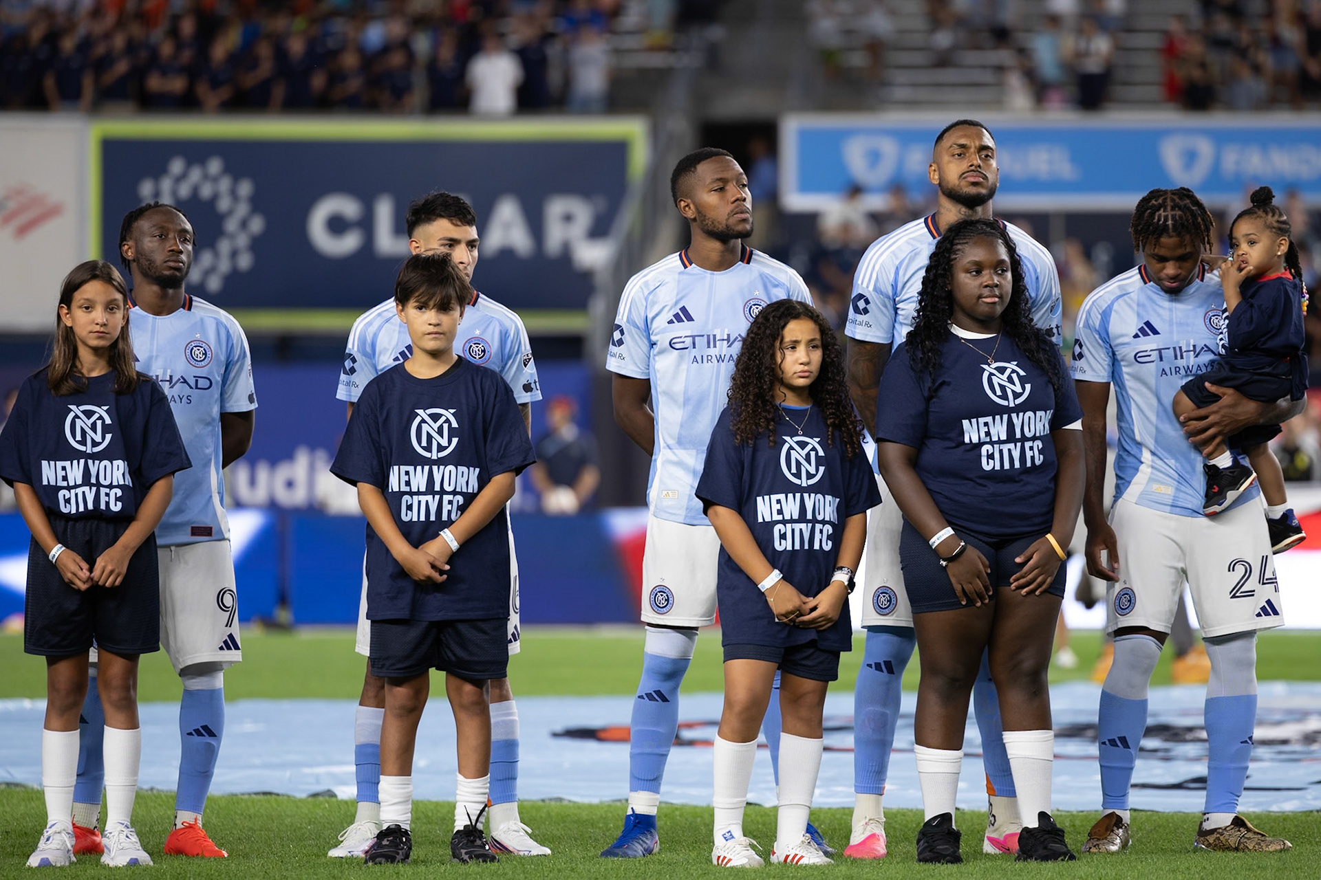 NYCFC players line up before kickoff.