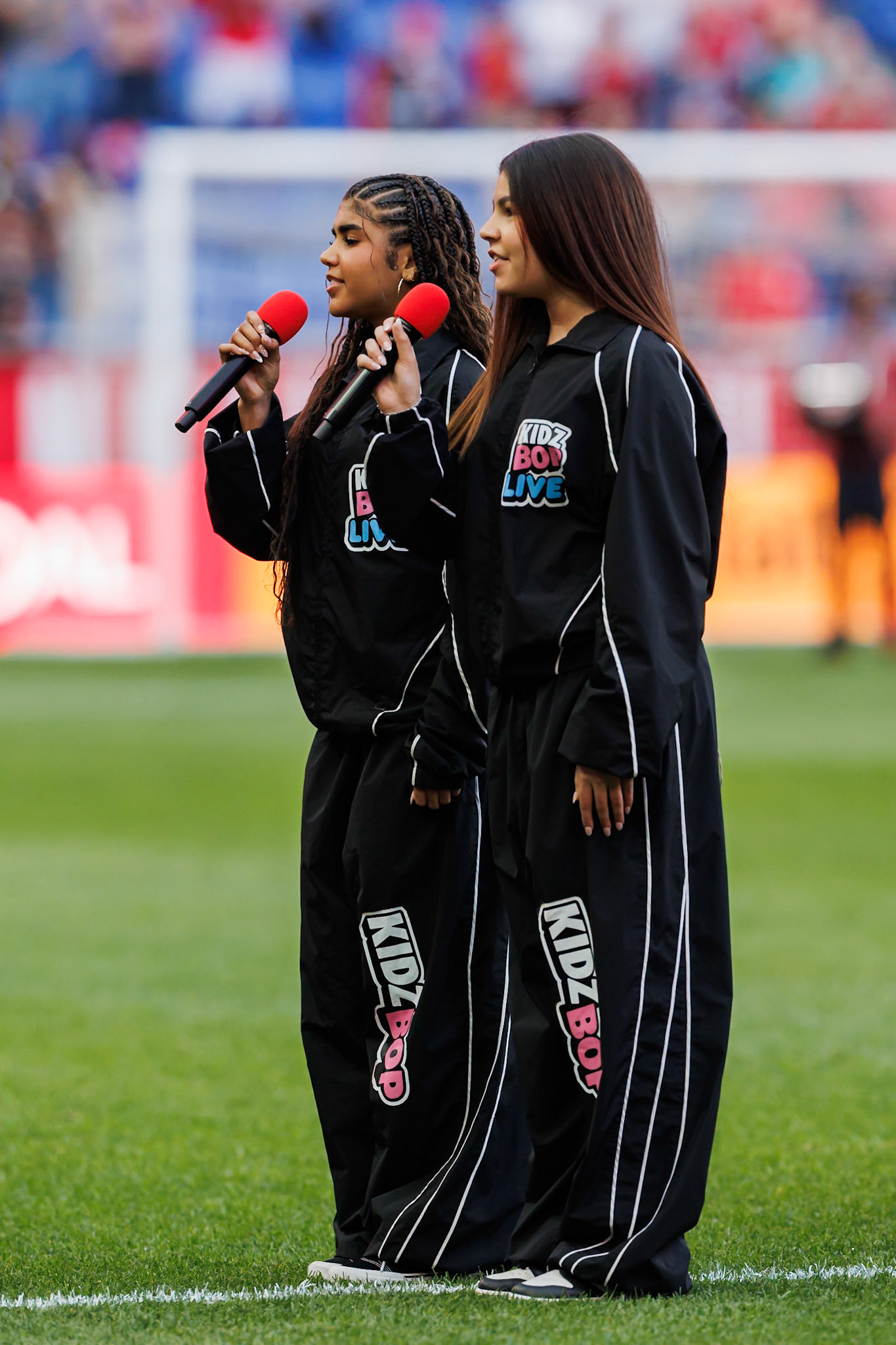 Performers sing the national anthem before kickoff.