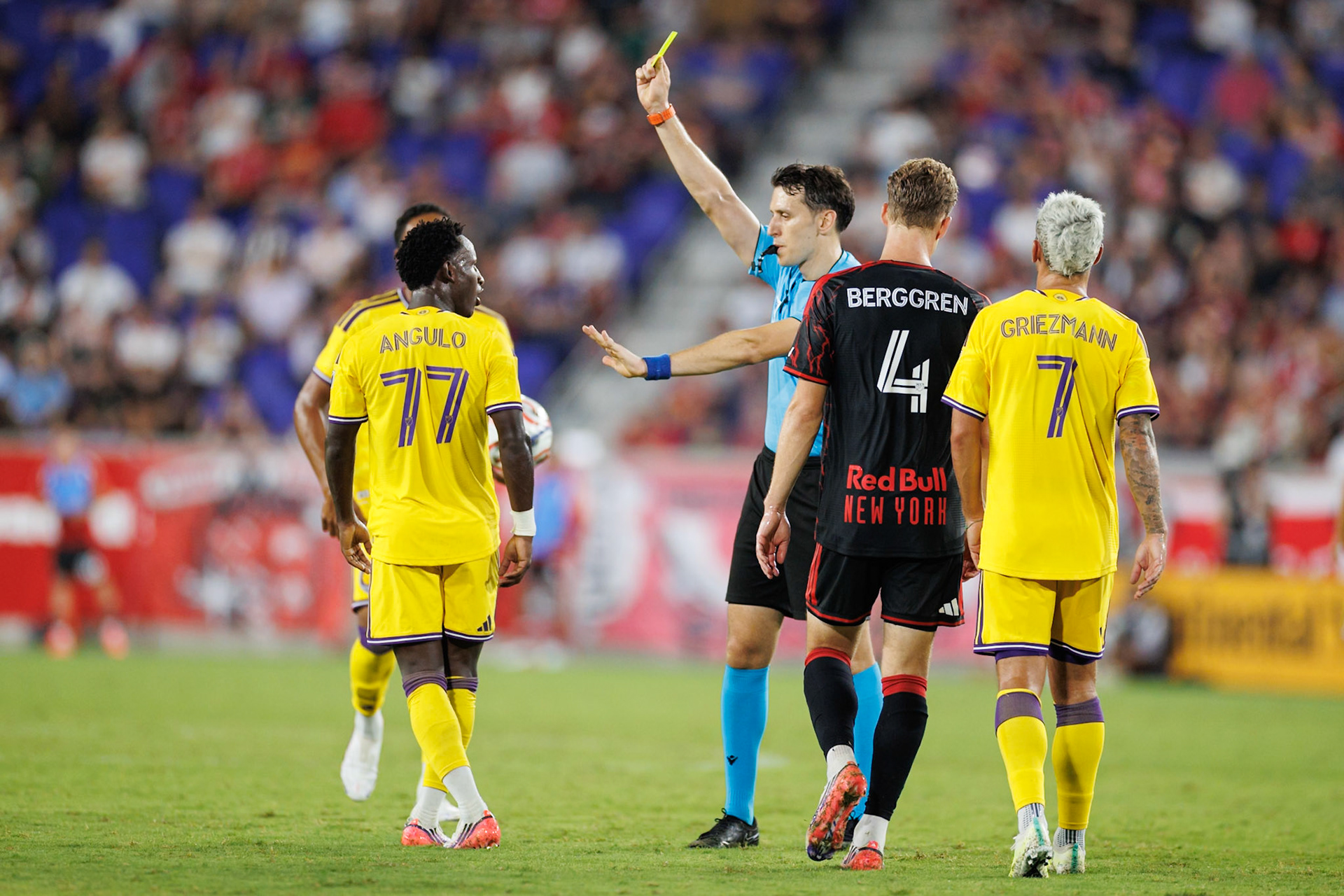 Iván Angulo is shown a yellow card during the match.
