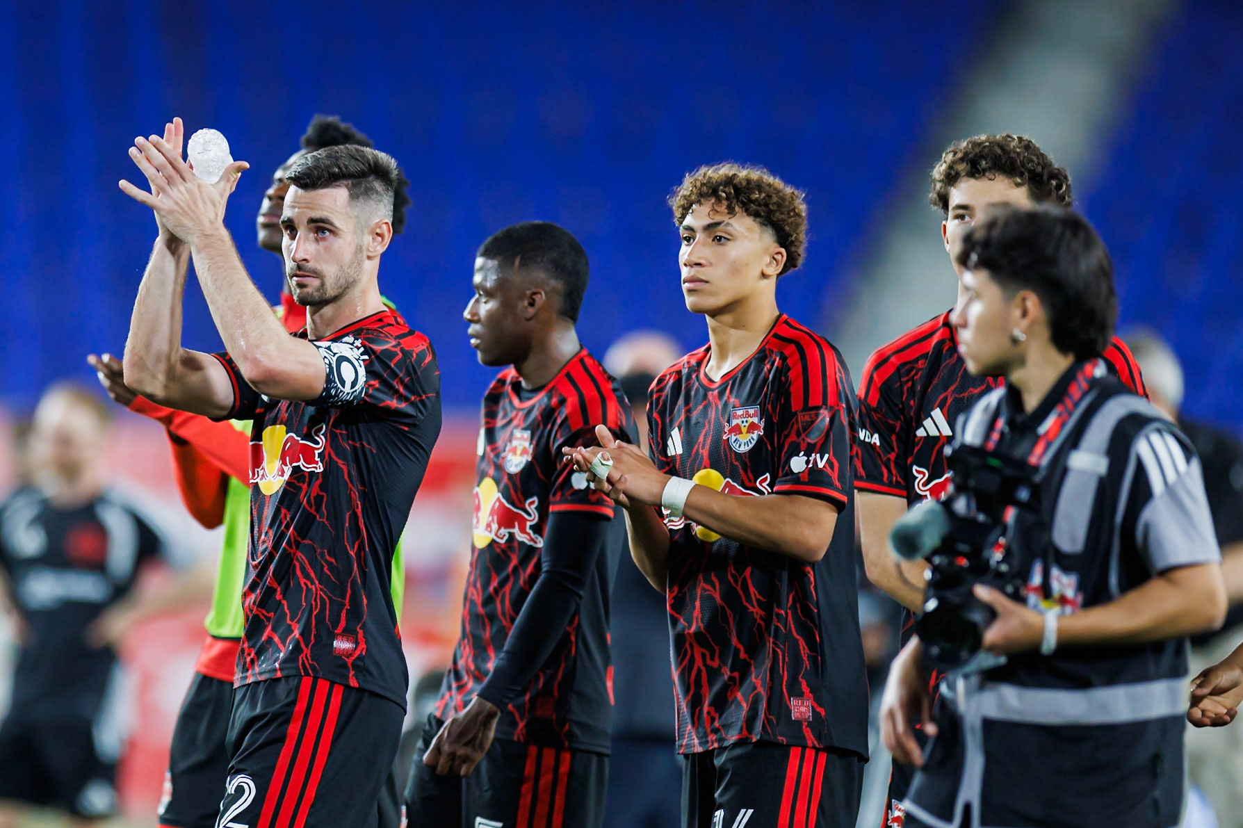 New York Red Bulls players acknowledge the supporters.
