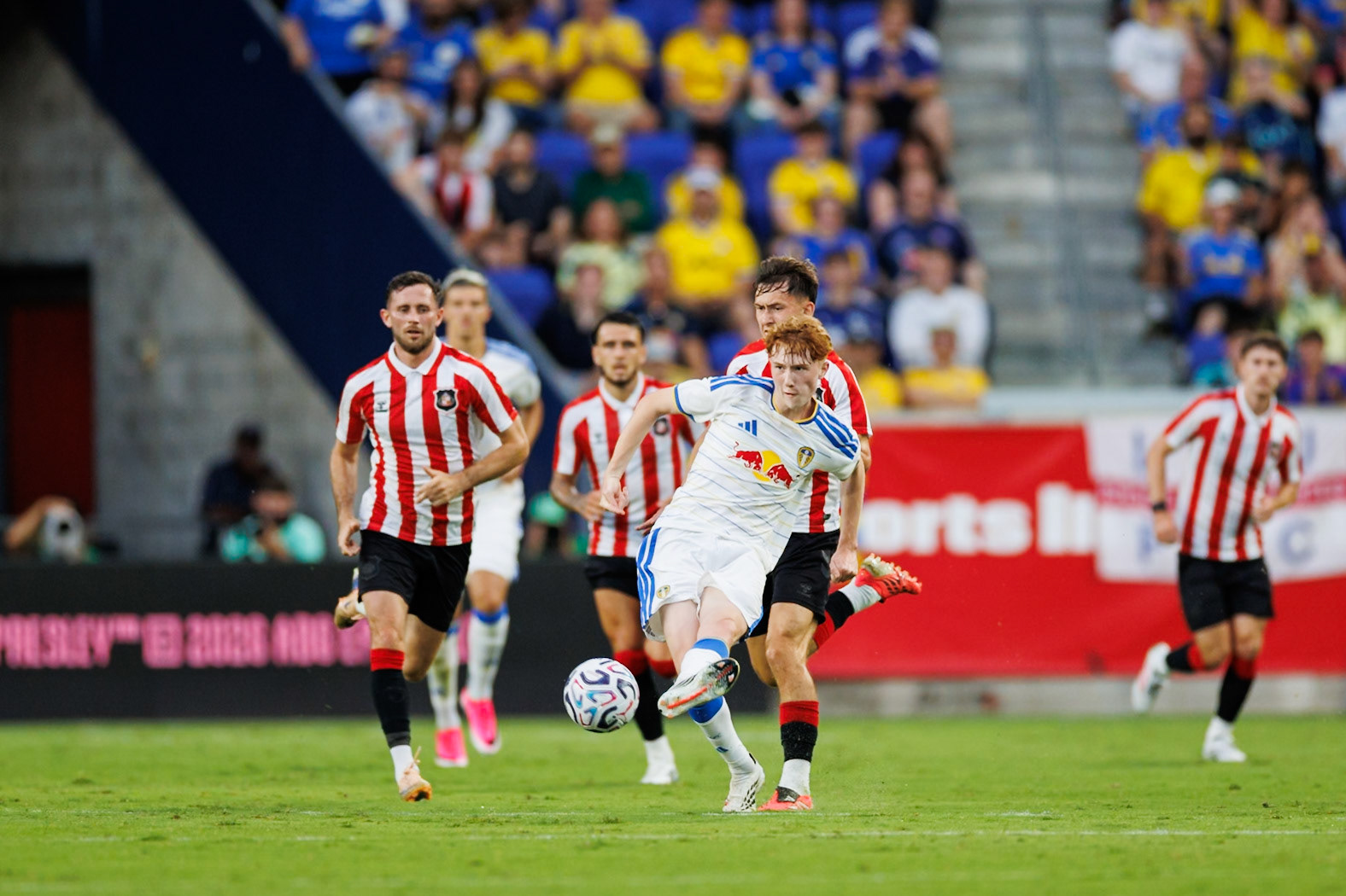 Leeds United player delivers a pass.
