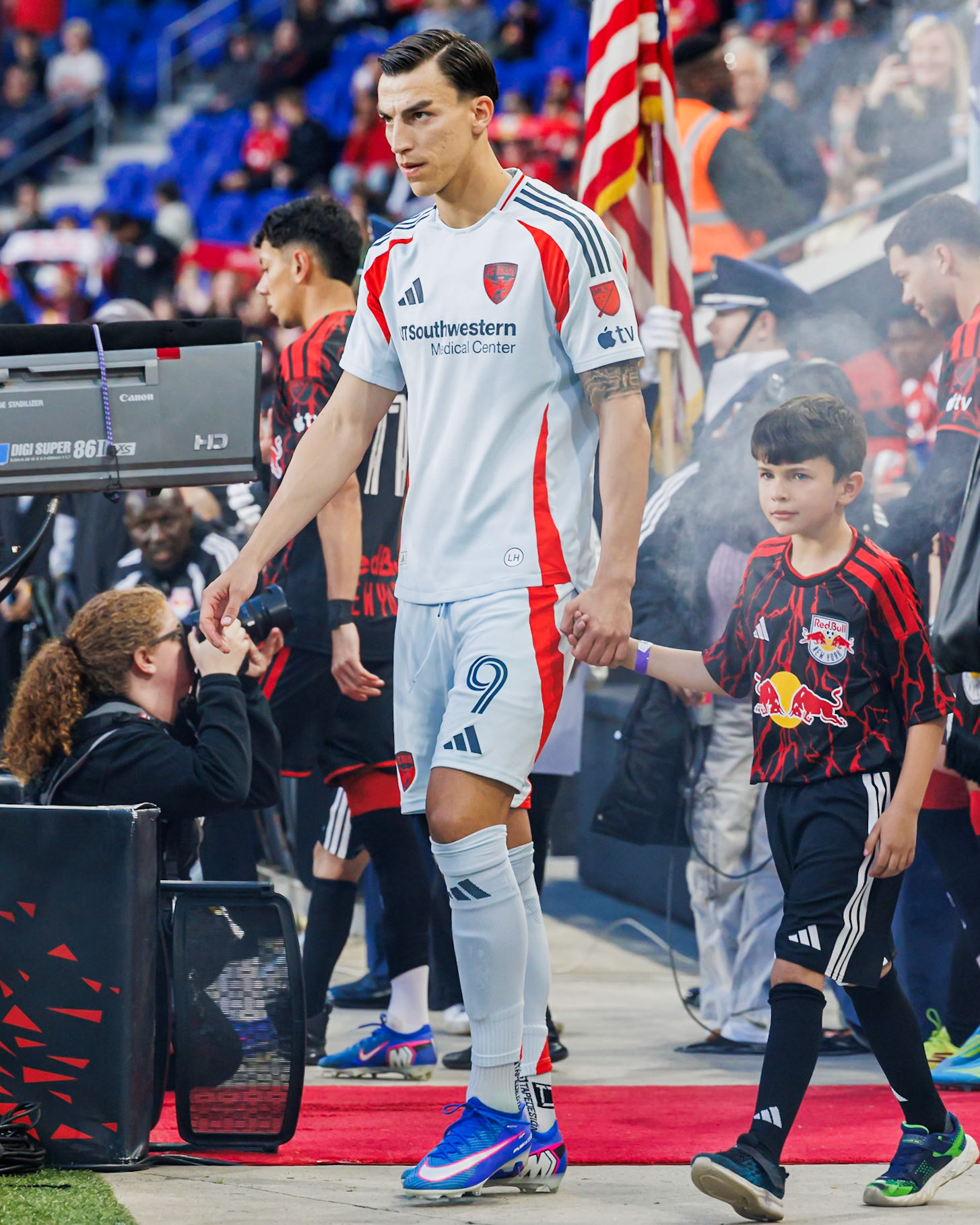 Petar Musa walks onto the field before the match.