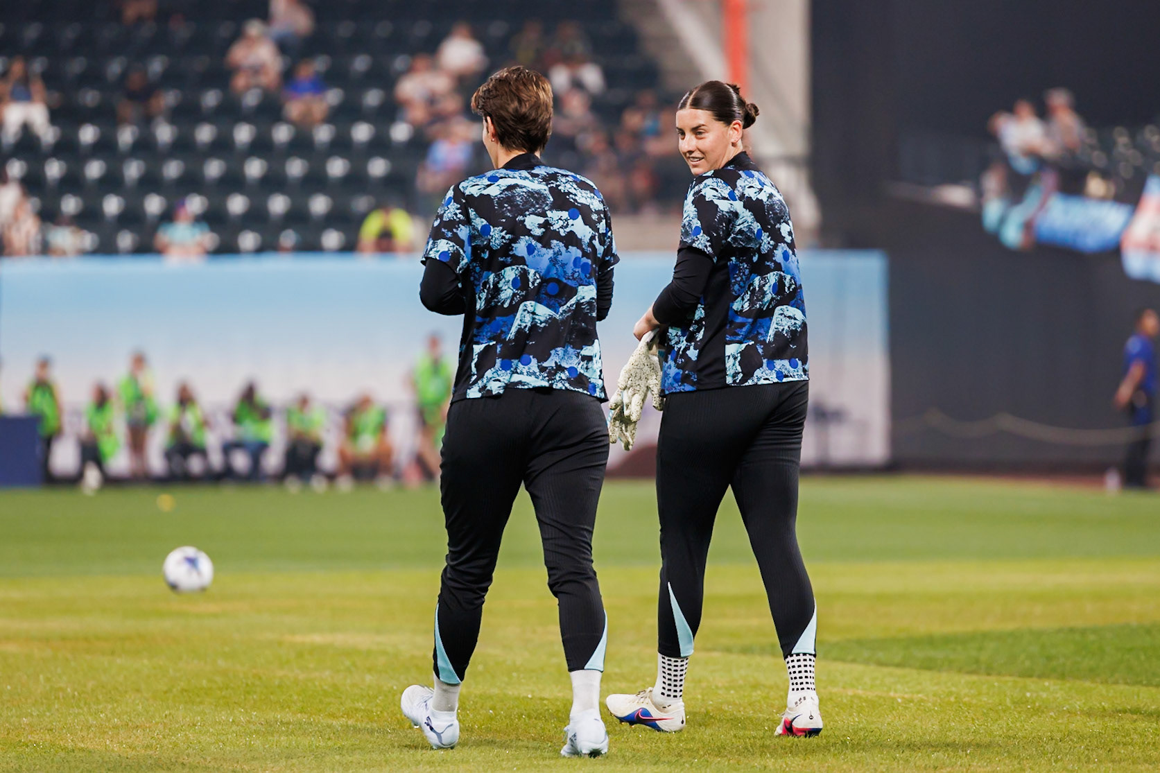 Gotham FC players warm up before The Queens Classic.