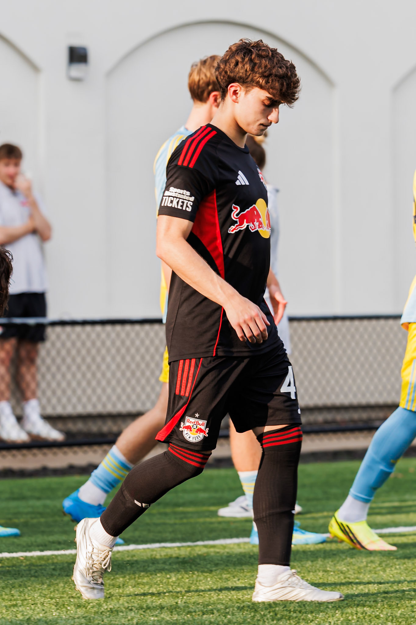 Connor Faello walks onto the field before the match.