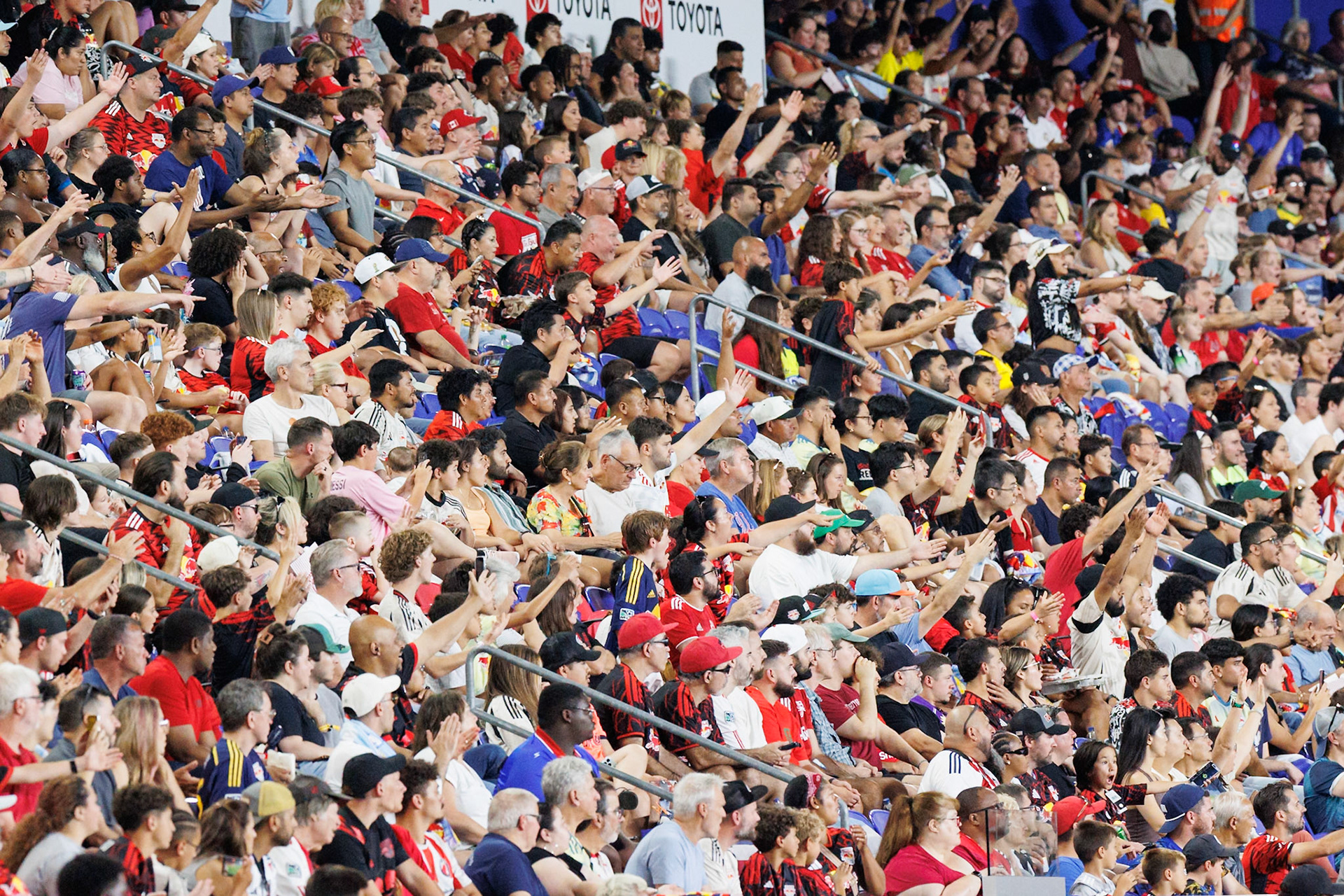 Supporters watch New York Red Bulls vs Orlando City SC at Sports Illustrated Stadium.