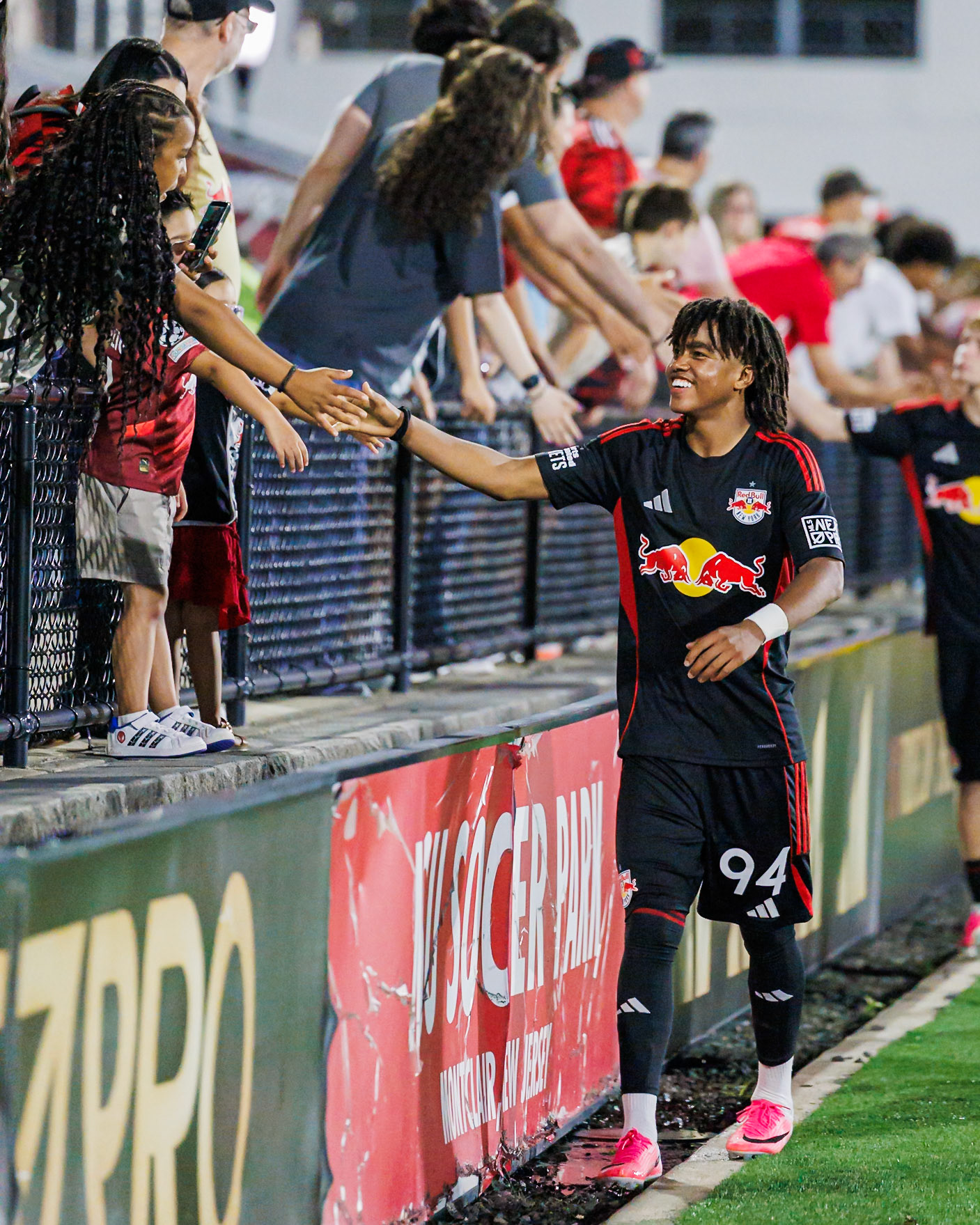 Sean Baitinger greets supporters after the match.