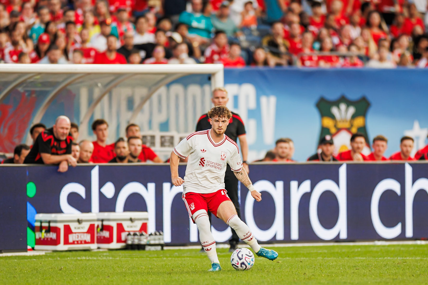 Harvey Elliott controls the ball for Liverpool.