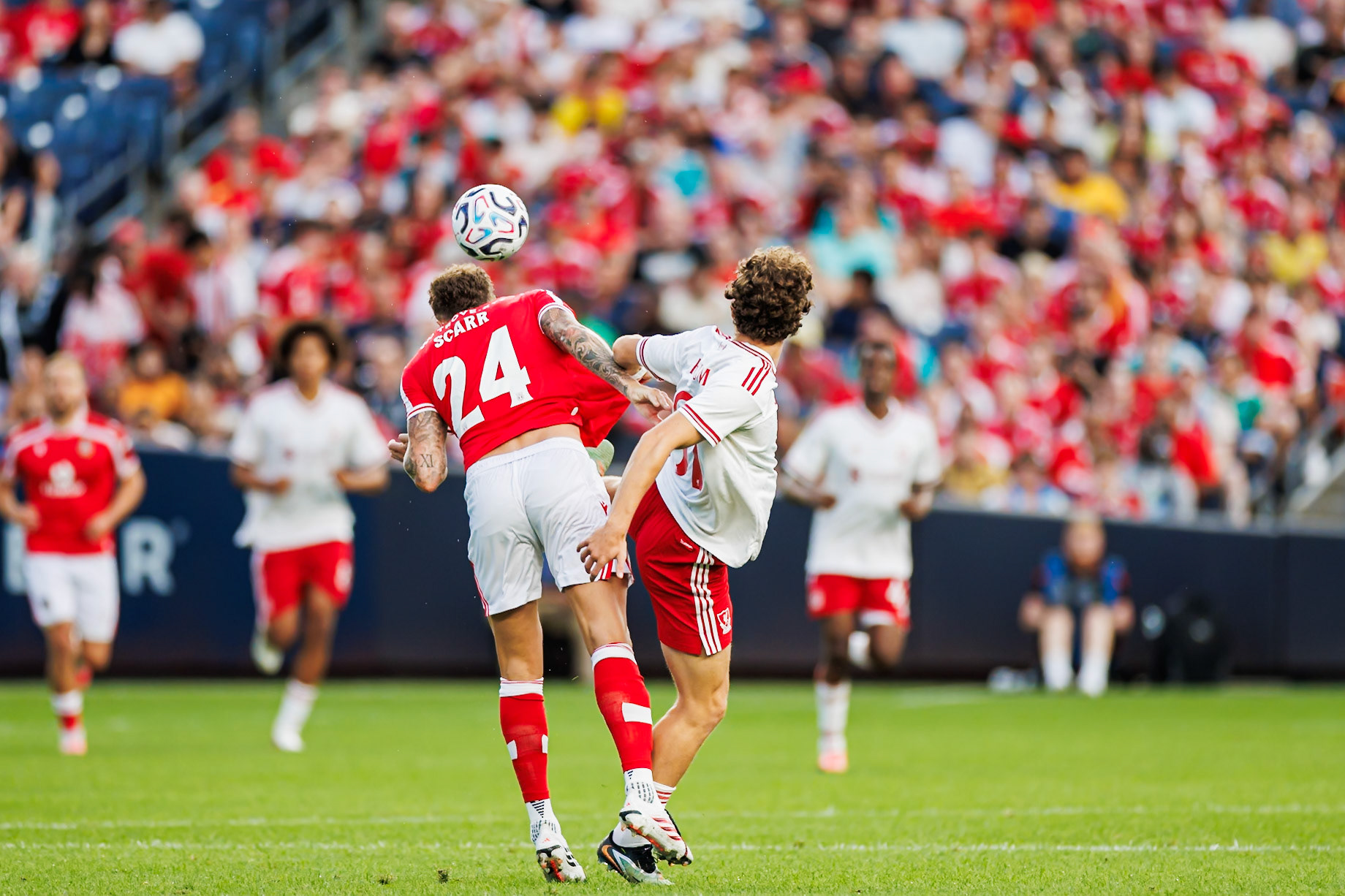 Players battle for possession at Yankee Stadium.