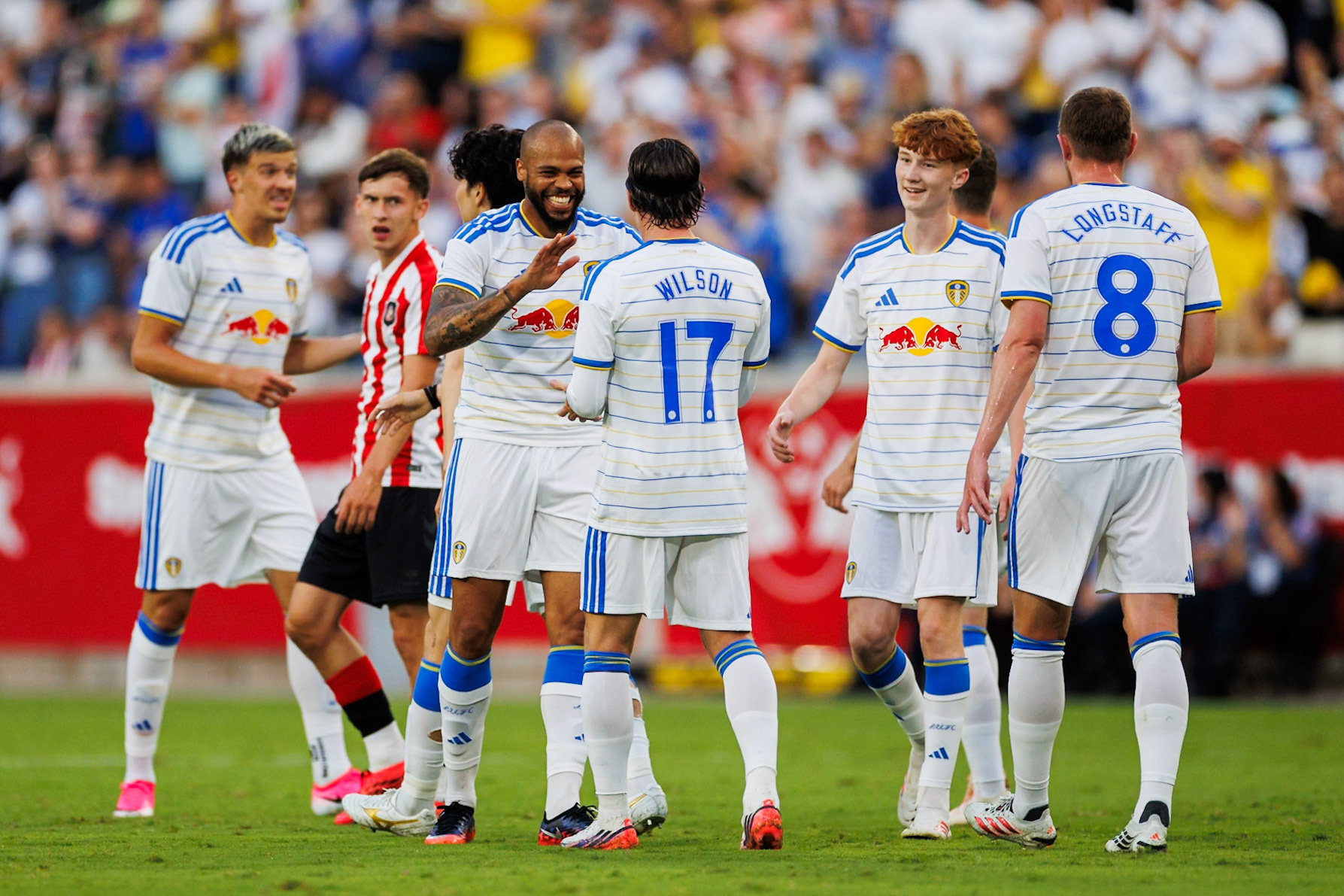 Leeds United players celebrate after scoring.
