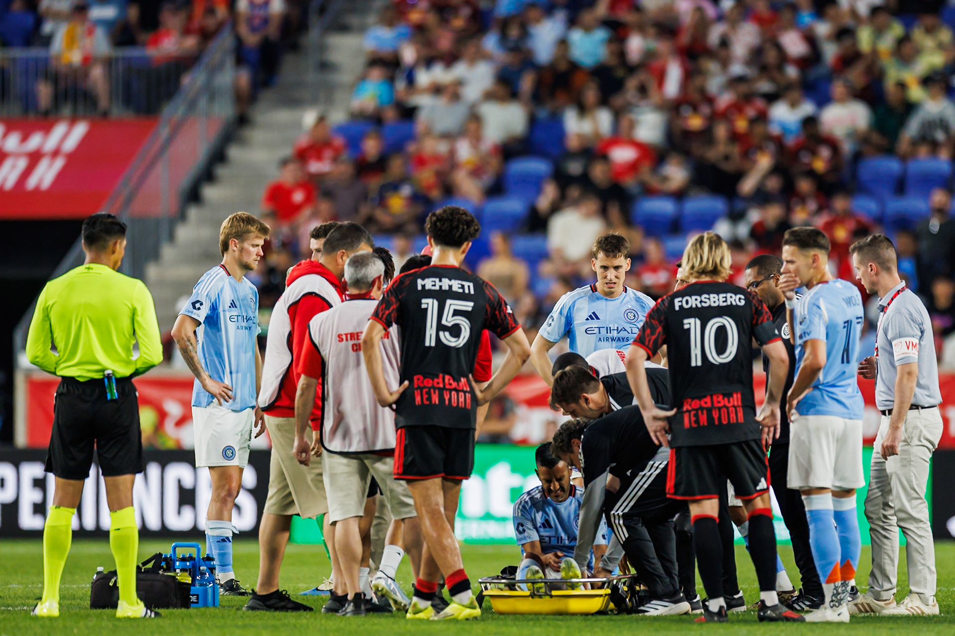 Medical staff attend to Maxi Moralez.