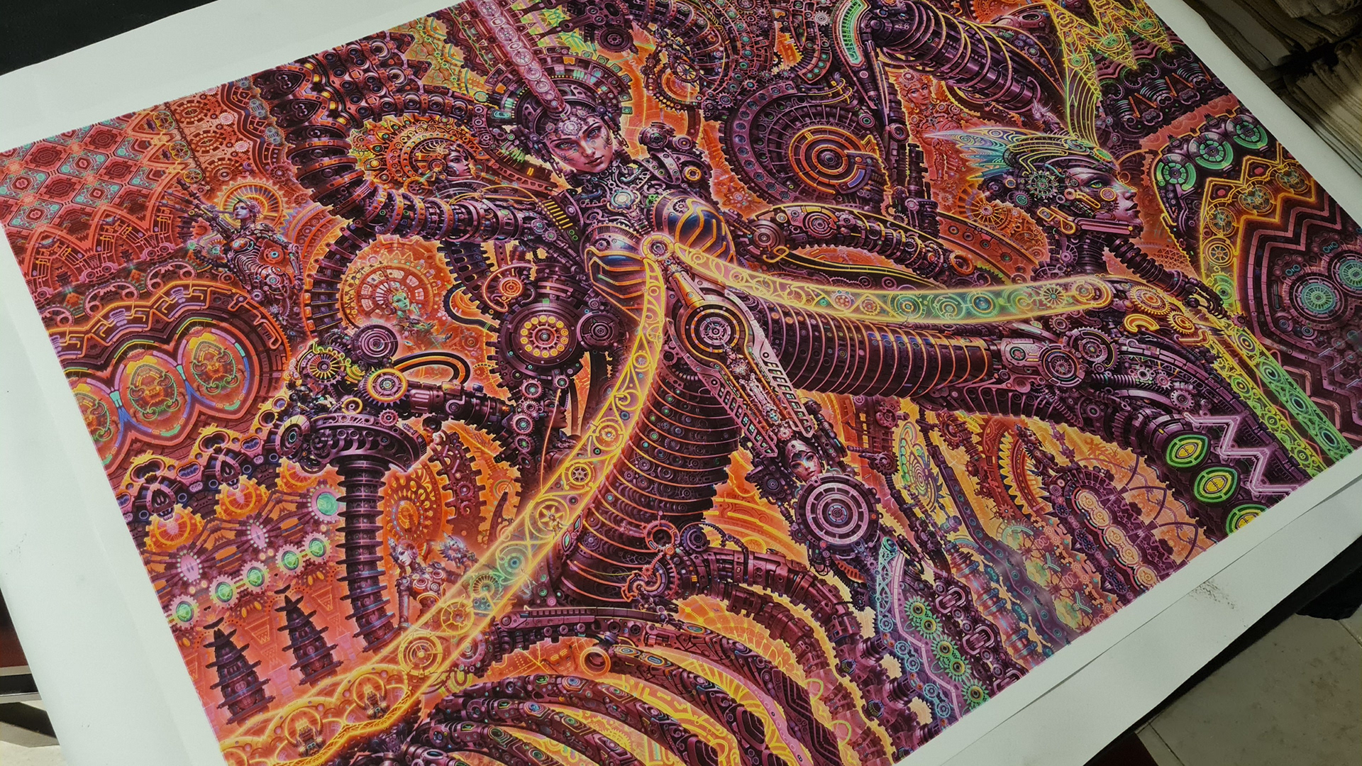 A high-detail psychedelic visionary artwork print by psychedelic visionary artist Nuwan Shilpa Hennayake from Sri Lanka featuring intricate biomechanical figures and Giger-esque patterns in vibrant orange, purple, and gold. The composition shows complex mechanical structures interwoven with humanoid forms and circular geometric mandalas.