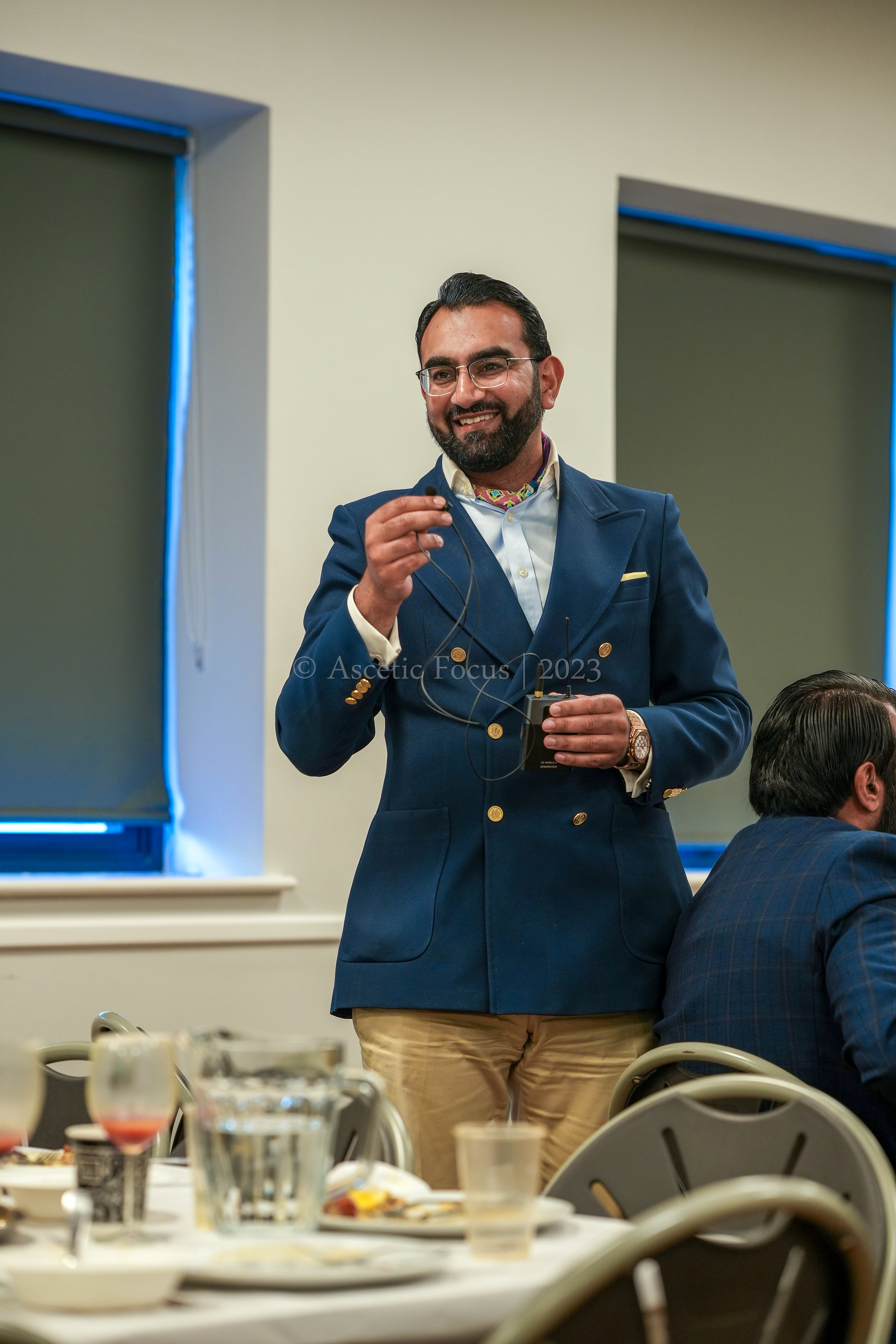 A person delivers an entertaining story during a graduation party