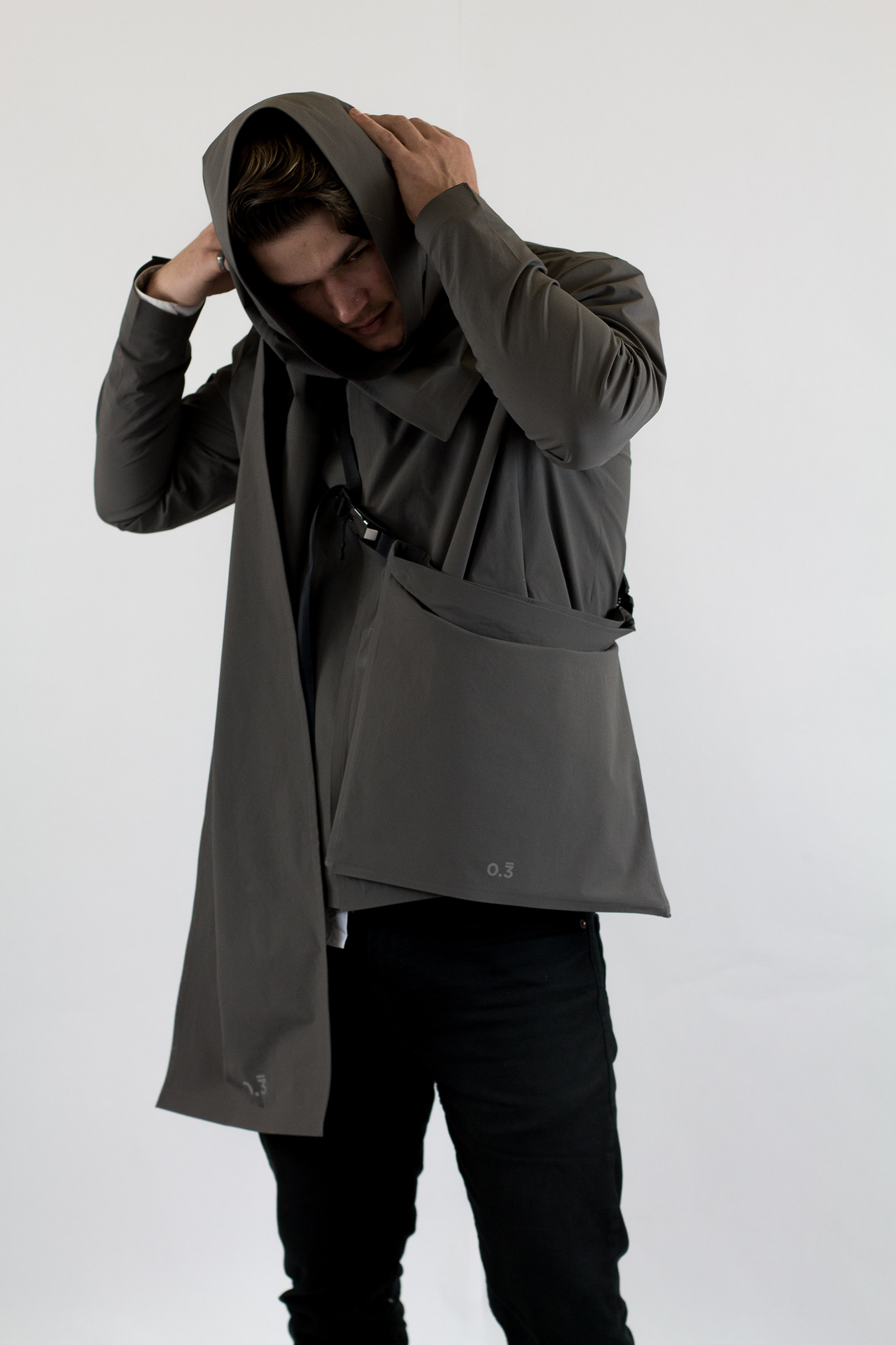 Scarf can be worn as a babushka, DWR coated fabric repels rain.