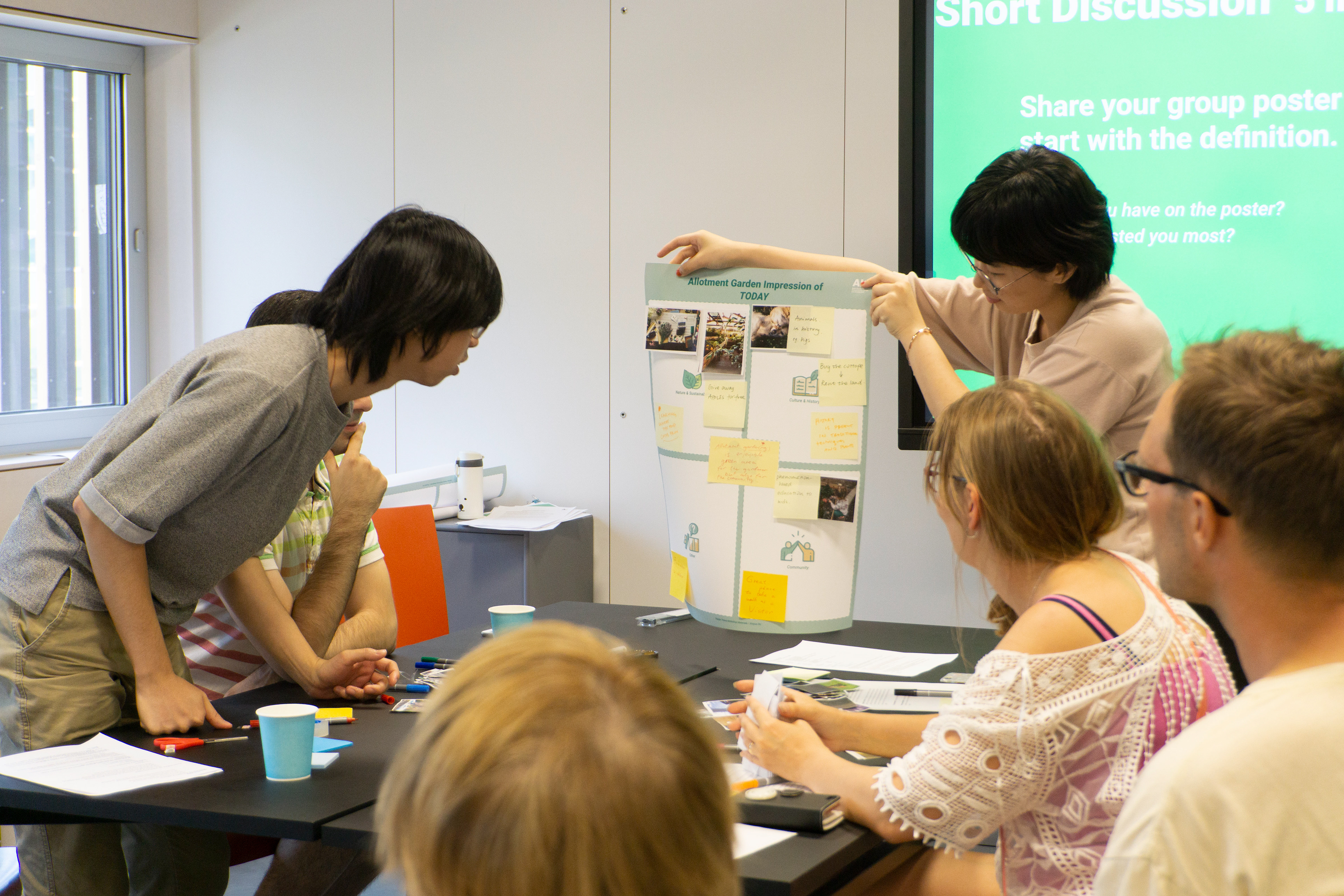Sharing poster ideas with the other group.