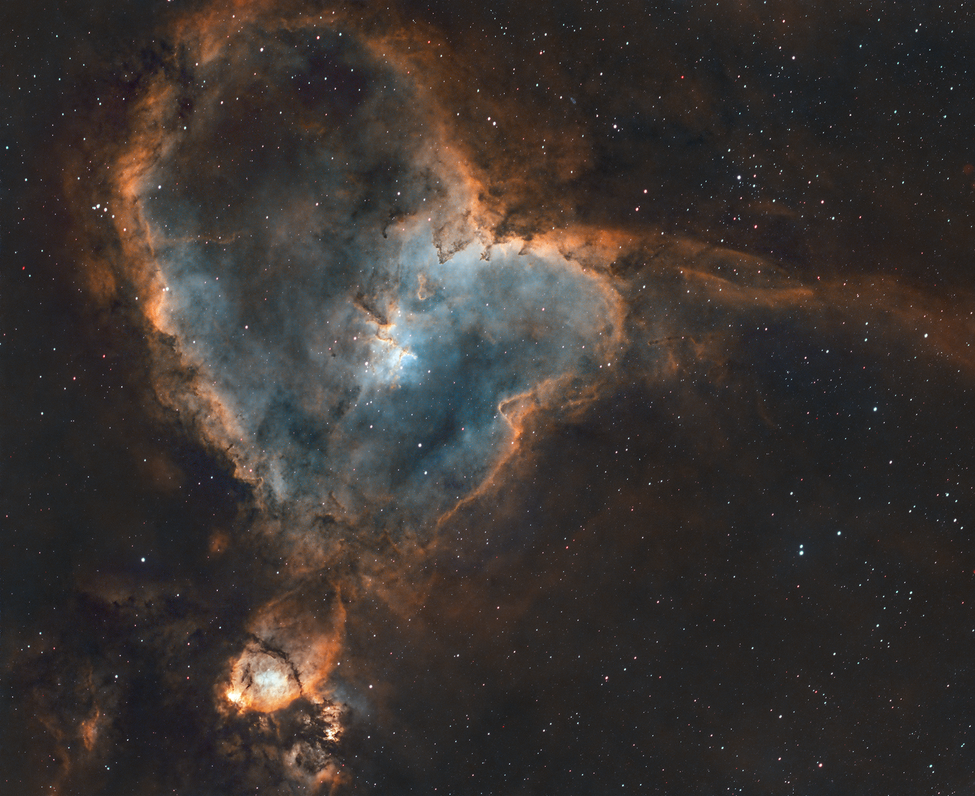 The Heart Nebula, officially known as IC 1805, is a vast and vibrant emission nebula located about 7,500 light-years away in the constellation Cassiopeia. This nebula gets its name from its distinctive, heart-like shape, with glowing clouds of ionized hydrogen gas creating its bright, reddish appearance. At its core lies the Melotte 15 star cluster, a collection of young, massive stars whose intense radiation and stellar winds sculpt the surrounding gas and dust into intricate patterns. The Heart Nebula is part of a larger star-forming region in the Perseus Arm of the Milky Way and is often associated with its neighbor, the Soul Nebula (IC 1848), together forming the iconic “Heart and Soul” duo in the night sky.