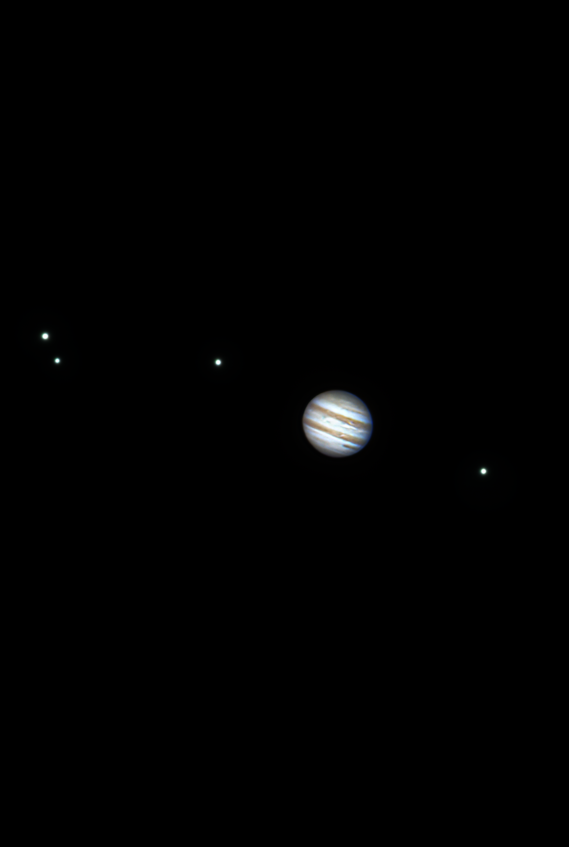 This image showcases Jupiter with its distinctive cloud bands and the Great Red Spot, accompanied by its four largest moons—Io, Europa, Ganymede, and Callisto—known as the Galilean moons. The bright dots around the planet are these moons, each with unique features, from Io’s volcanic activity to Europa’s icy ocean, Ganymede’s size, and Callisto’s ancient craters. This view highlights the dynamic atmosphere of Jupiter and the diversity of its moon system.