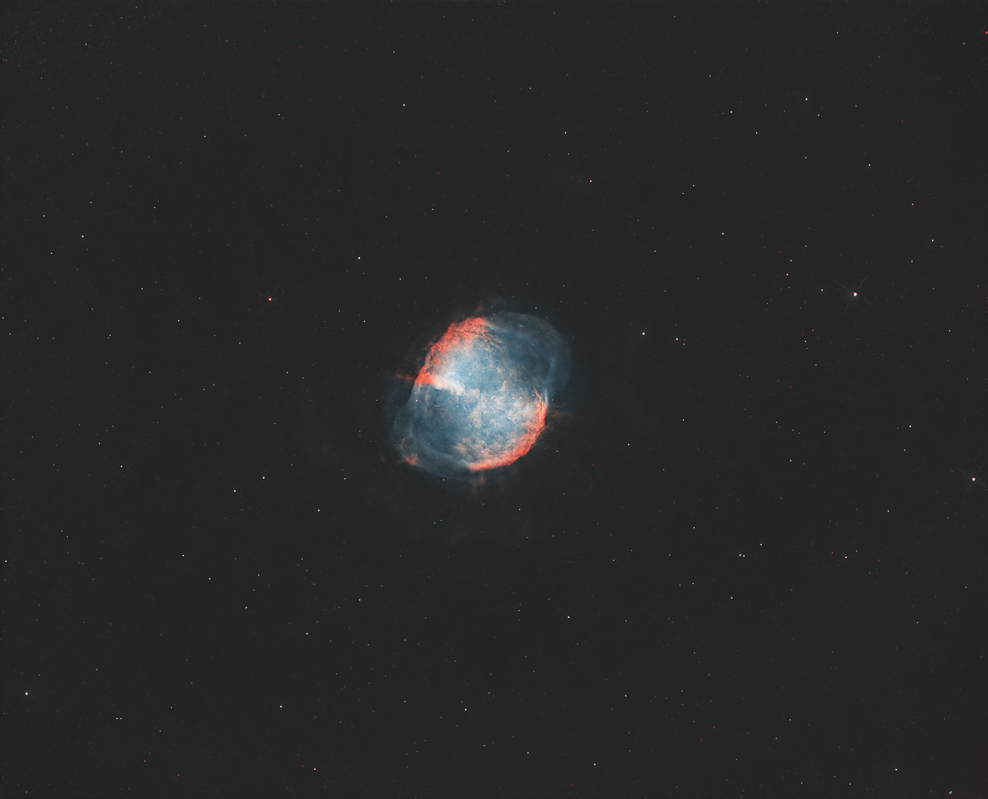 M27, also known as the Dumbbell Nebula, is a bright and well-known planetary nebula located about 1,360 light-years away in the constellation Vulpecula. Discovered by Charles Messier in 1764, it was the first planetary nebula to be identified. The nebula’s name comes from its distinctive, dumbbell-like shape, created by the expanding shell of ionized gas ejected from a dying star. At the center lies a white dwarf, the remnant of the original star. The Dumbbell Nebula showcases vibrant colors, with reds and greens representing hydrogen and oxygen emissions, respectively. It provides a fascinating glimpse into the final stages of stellar evolution, demonstrating the fate that awaits stars like our Sun.