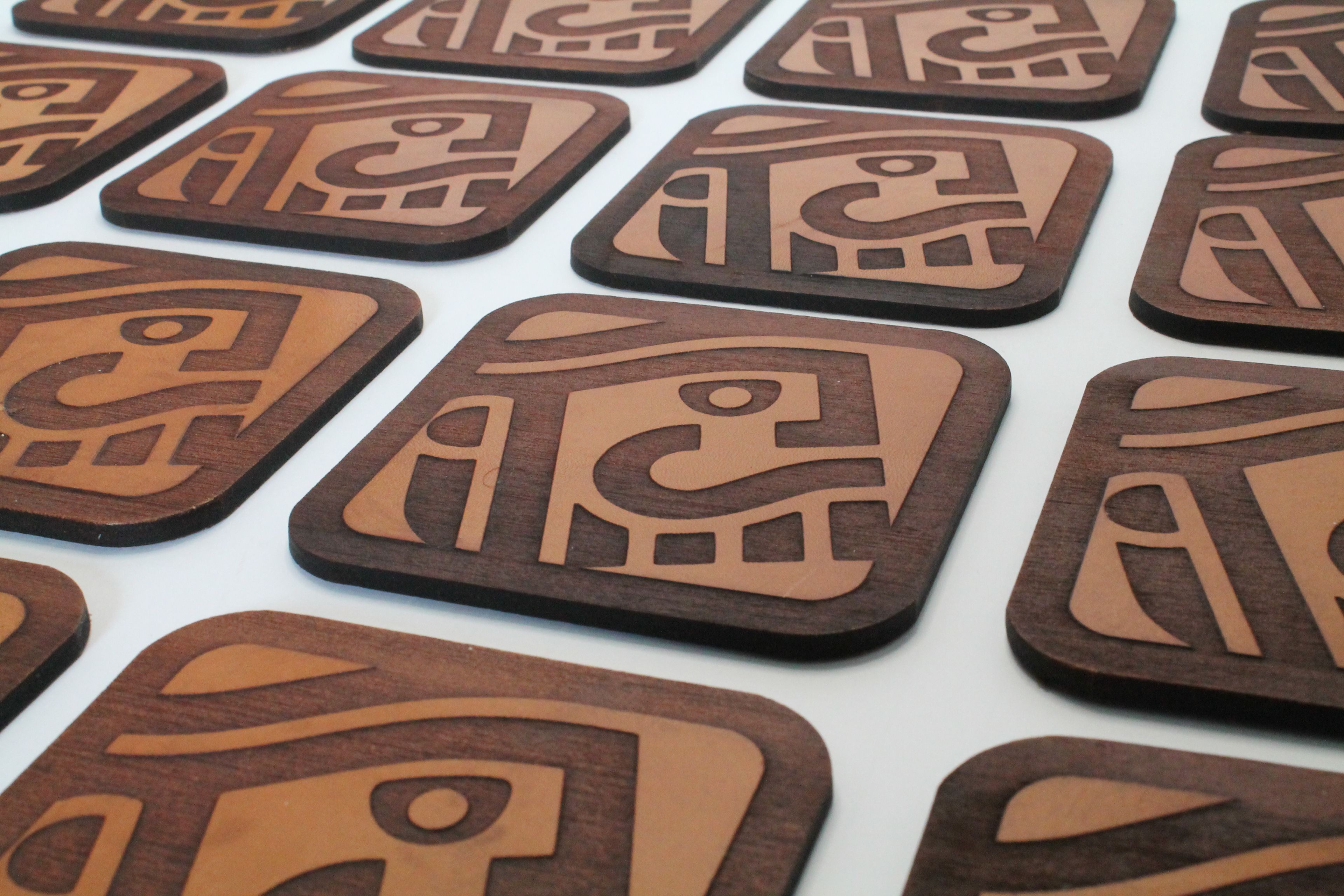 Laser cut and engraved leather coasters.